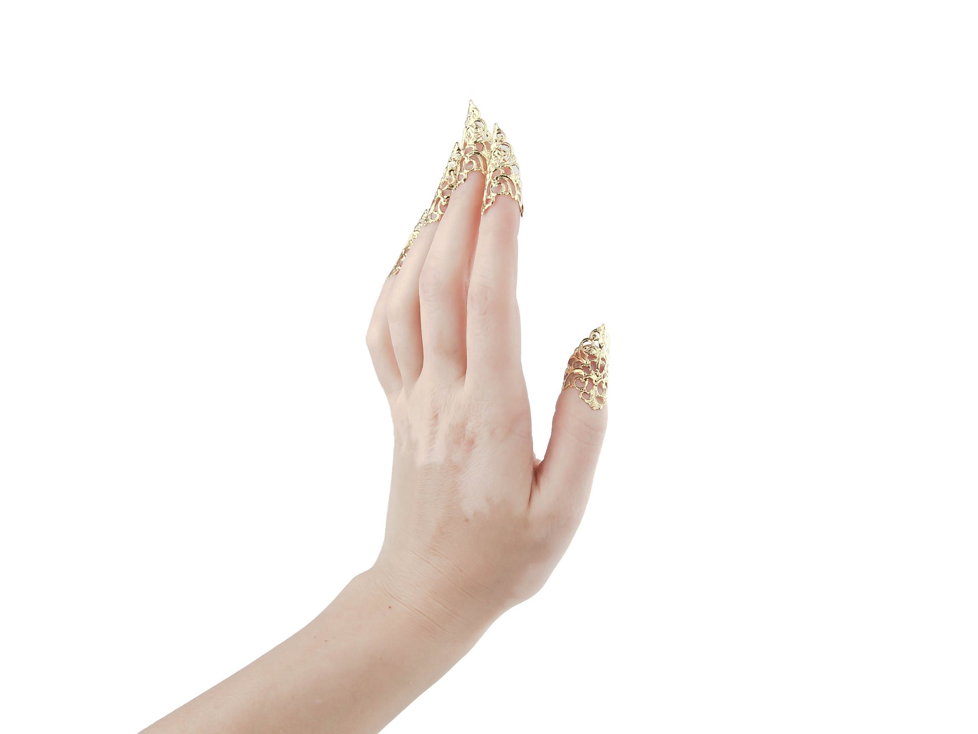 A hand gracefully showcases Myril Jewels' goth gold nail rings, featuring delicate filigree claws. These unique pieces are ideal for adding a touch of neo-gothic sophistication to any outfit, perfect for daily wear or as a statement accessory at a whimsigoth event or festival.