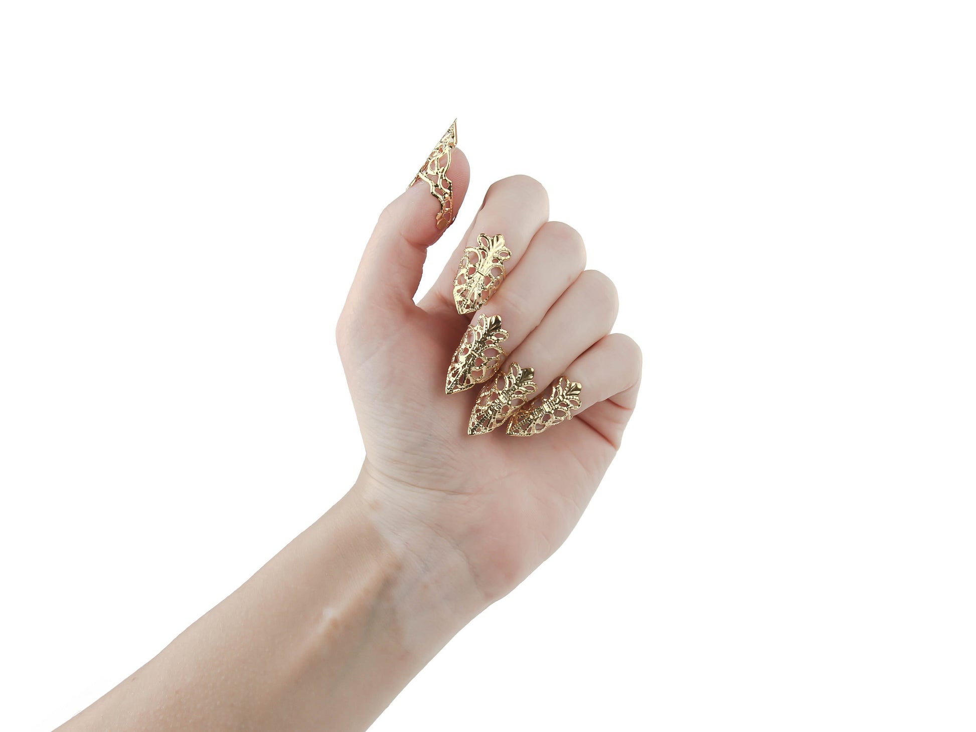A hand models Myril Jewels' full set of gold claw rings, their delicate filigree design evoking the dark intricacies of Neo Gothic artistry. These statement jewelry pieces are synonymous with the brand's commitment to creating avant-garde, gothic-inspired jewelry, perfect for individuals who gravitate towards Gothic Lolita, Gothic-chic, and Whimsigoth aesthetics. Ideal for Halloween, daily minimal goth style, or as a dramatic accent for drag queens and performances