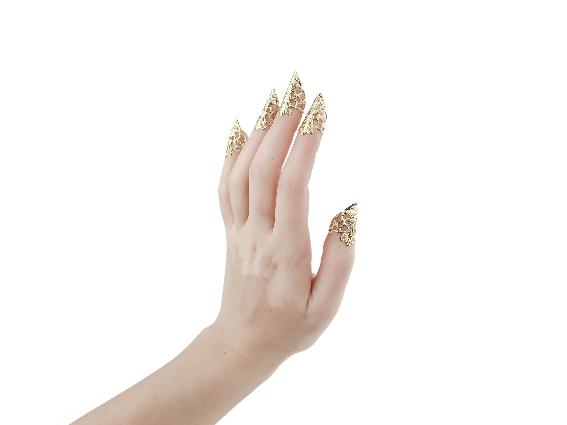 A hand models Myril Jewels' full set of gold claw rings, their delicate filigree design evoking the dark intricacies of Neo Gothic artistry. These statement jewelry pieces are synonymous with the brand's commitment to creating avant-garde, gothic-inspired jewelry, perfect for individuals who gravitate towards Gothic Lolita, Gothic-chic, and Whimsigoth aesthetics. Ideal for Halloween, daily minimal goth style, or as a dramatic accent for drag queens and performances
