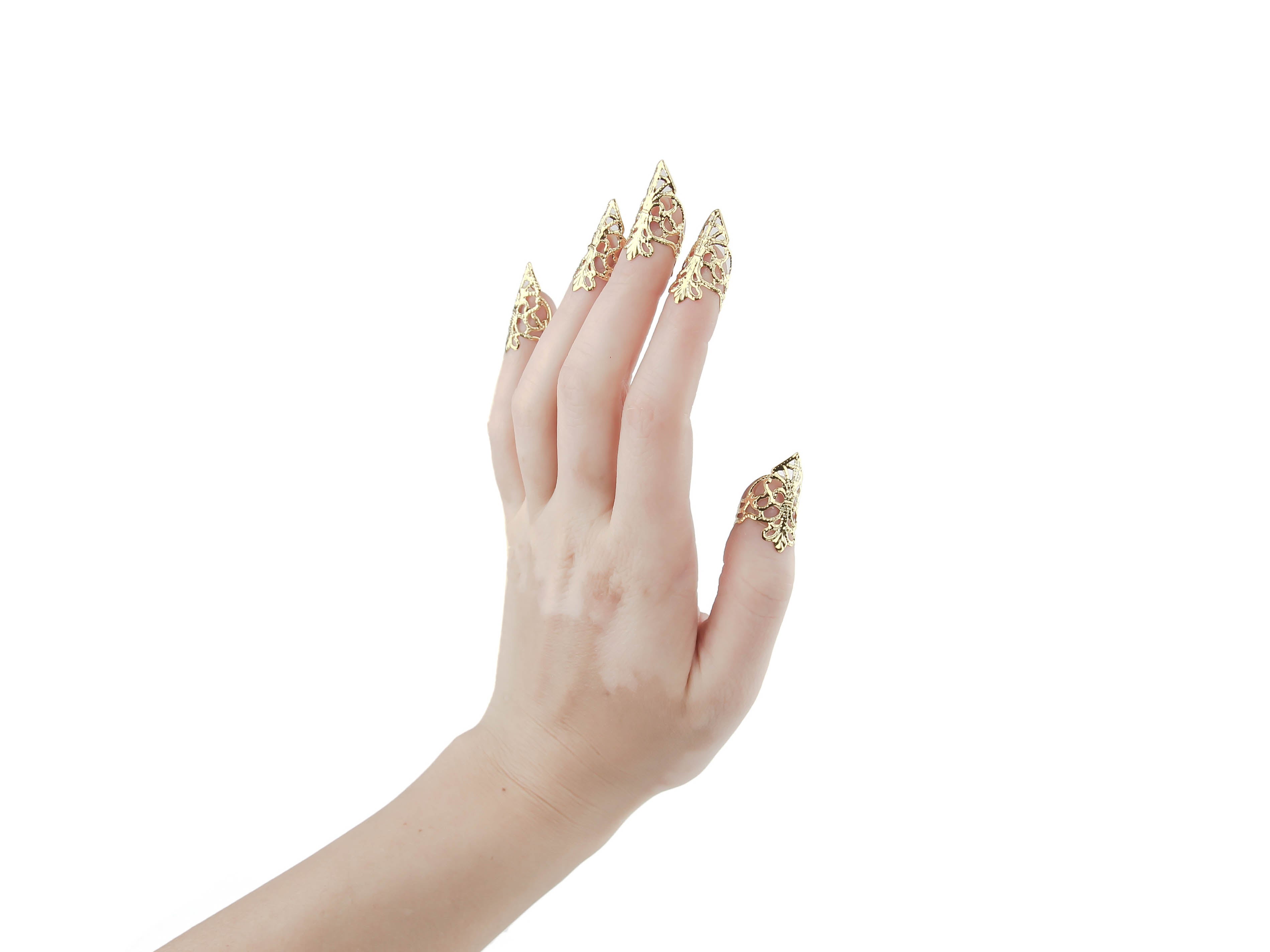 A hand models Myril Jewels' full set of gold claw rings, their delicate filigree design evoking the dark intricacies of Neo Gothic artistry. These statement jewelry pieces are synonymous with the brand's commitment to creating avant-garde, gothic-inspired jewelry, perfect for individuals who gravitate towards Gothic Lolita, Gothic-chic, and Whimsigoth aesthetics. Ideal for Halloween, daily minimal goth style, or as a dramatic accent for drag queens and performances