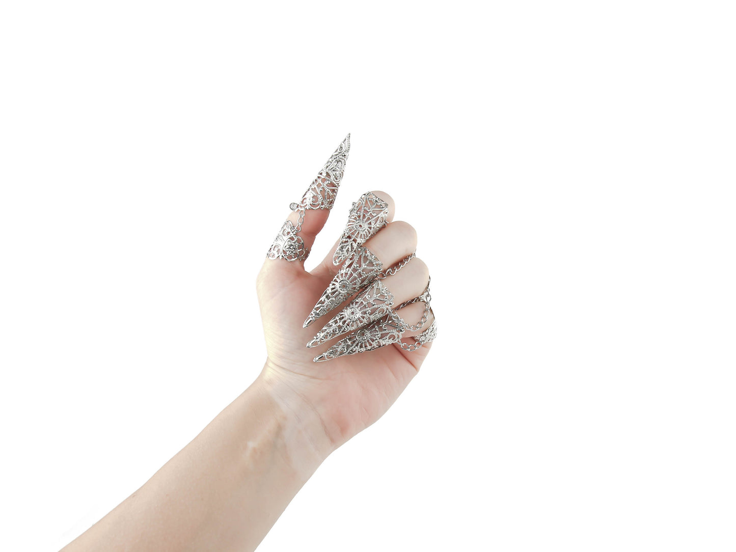 A full hand adorned with Myril Jewels' ornate rings, each finger capped with an elegant nail claw. These pieces capture the essence of dark-avantgarde style, ideal for a neo-gothic look or adding a dramatic touch to witchcore and whimsigoth outfits, perfect for festivals or as a unique goth girlfriend gift.