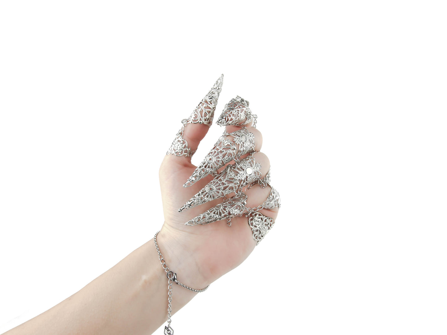 An elegant silver full hand metal glove with intricate claw rings creates a striking silhouette against a white background, a signature Myril Jewels design. This dark, avant-garde accessory embodies neo-gothic luxury, perfect for gothic, Witchcore, and punk fashion enthusiasts seeking bold jewelry statements