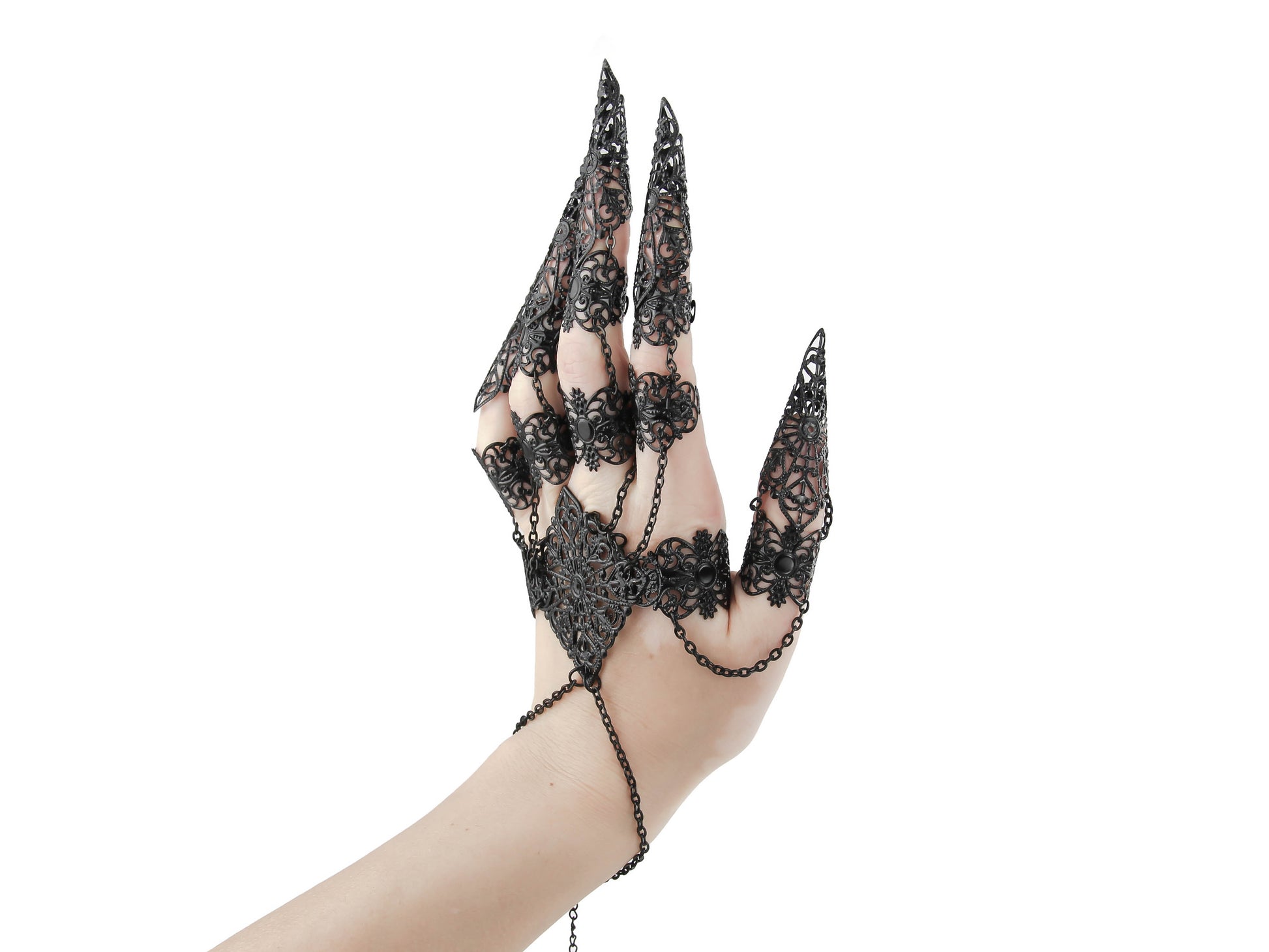 An ornate full hand black metal glove with claw rings from Myril Jewels encapsulates a neo-goth aesthetic. This exquisite piece is ideal for anyone seeking bold, dark-avantgarde jewelry, perfectly suited for gothic, punk, or Whimsigoth styles and makes an unforgettable goth girlfriend gift.