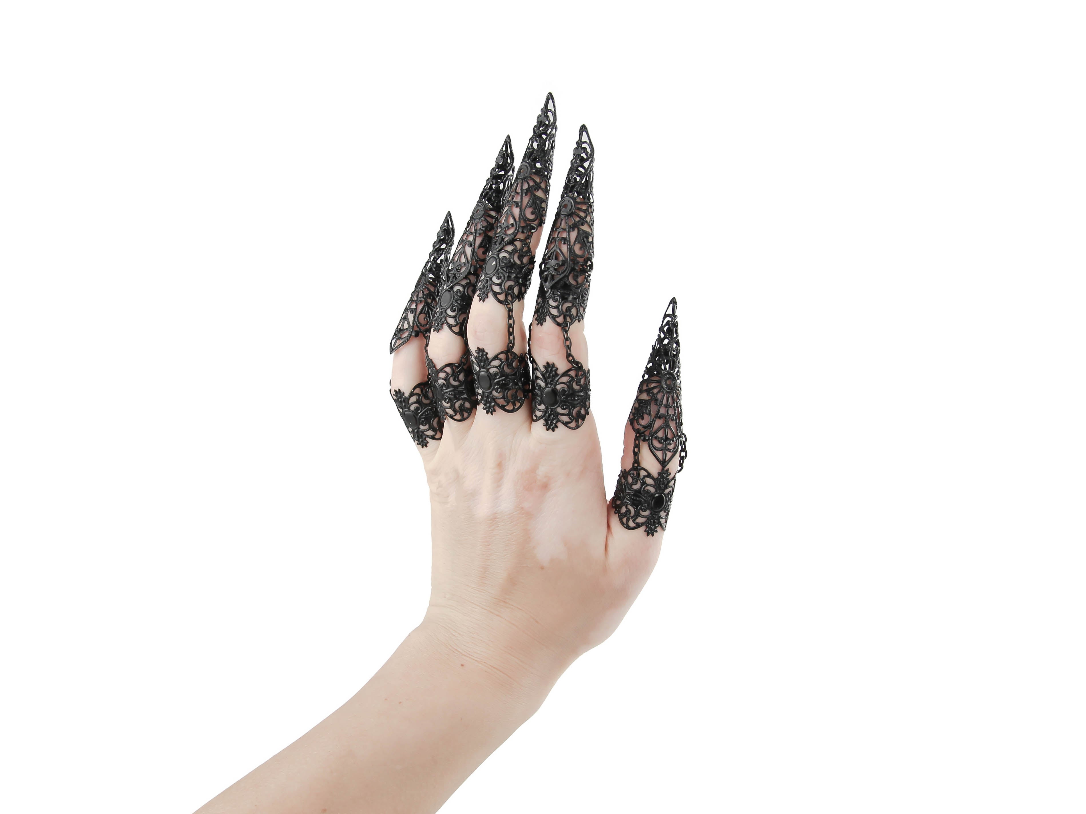 Unleash your inner goth with Myril Jewels' full hand set of black armored claw rings, intricately designed for the bold and the avant-garde. These striking silver filigree rings are perfect for a dramatic Halloween look, Neo Gothic fashion, and Gothic-chic ensembles. They cater to the whimsigoth and witchcore aesthetic, offering a standout accessory for everyday wear, minimal goth stylings, and are also ideal for drag queens and performance art
