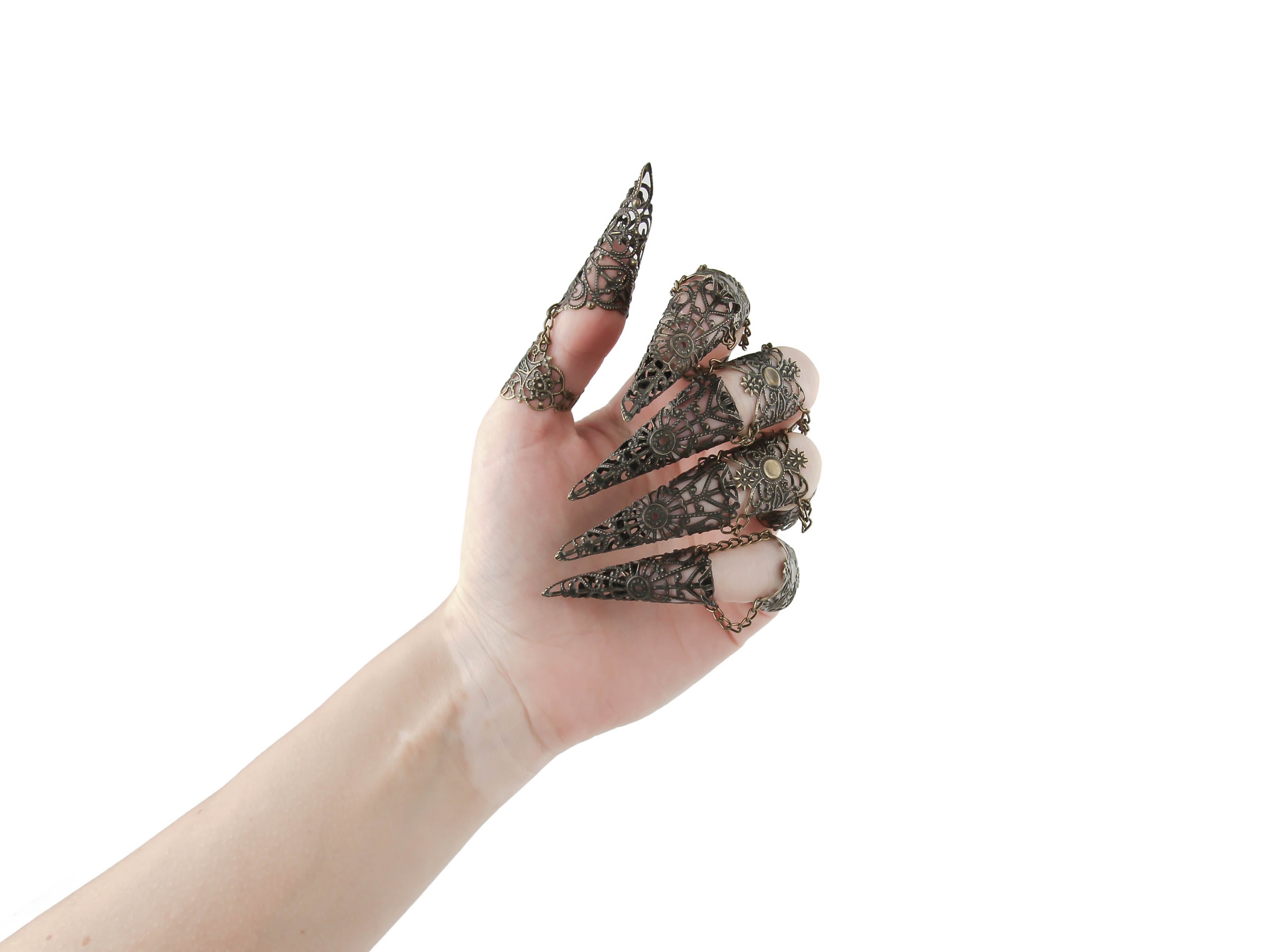 Unleash your inner goth with Myril Jewels' full hand set of black armored claw rings, intricately designed for the bold and the avant-garde. These striking silver filigree rings are perfect for a dramatic Halloween look, Neo Gothic fashion, and Gothic-chic ensembles. They cater to the whimsigoth and witchcore aesthetic, offering a standout accessory for everyday wear, minimal goth stylings, and are also ideal for drag queens and performance art