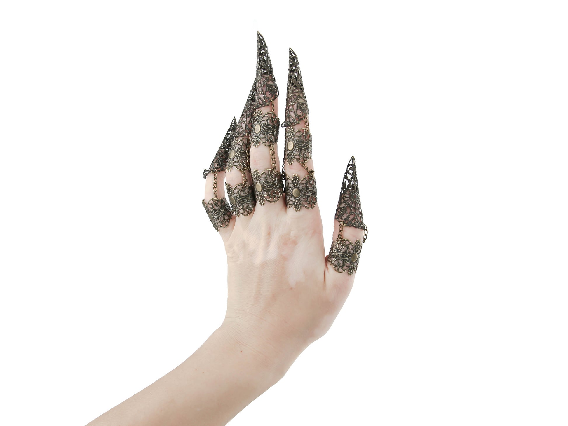 Dive into the bold world of Myril Jewels with this full hand set of armored bronze claw rings, perfect for the gothic and alternative style enthusiast. Crafted with exquisite filigree, these rings are ideal for anyone looking to make a statement, from Halloween events to drag performances. They embody the spirit of Neo Gothic, Witchcore, and Whimsigoth, providing a striking complement to any minimal goth or Gothic-chic look.