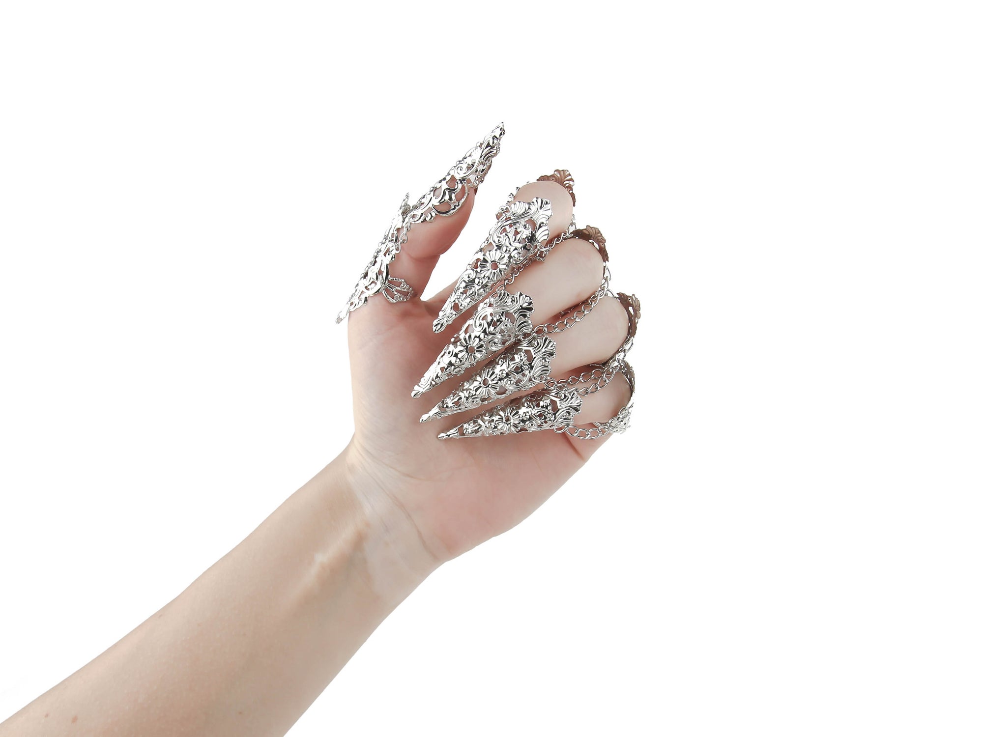A hand models a full set of intricate claw rings from Myril Jewels, epitomizing the neo-goth aesthetic. Perfect for those drawn to dark, avant-garde fashion, these rings are a match for Halloween, punk styles, and gothic-chic looks. Suitable for witchcore, everyday wear, or as statement jewelry at raves and festivals, they make a bold gift for a goth girlfriend or anyone who adores unique, handcrafted accessories.