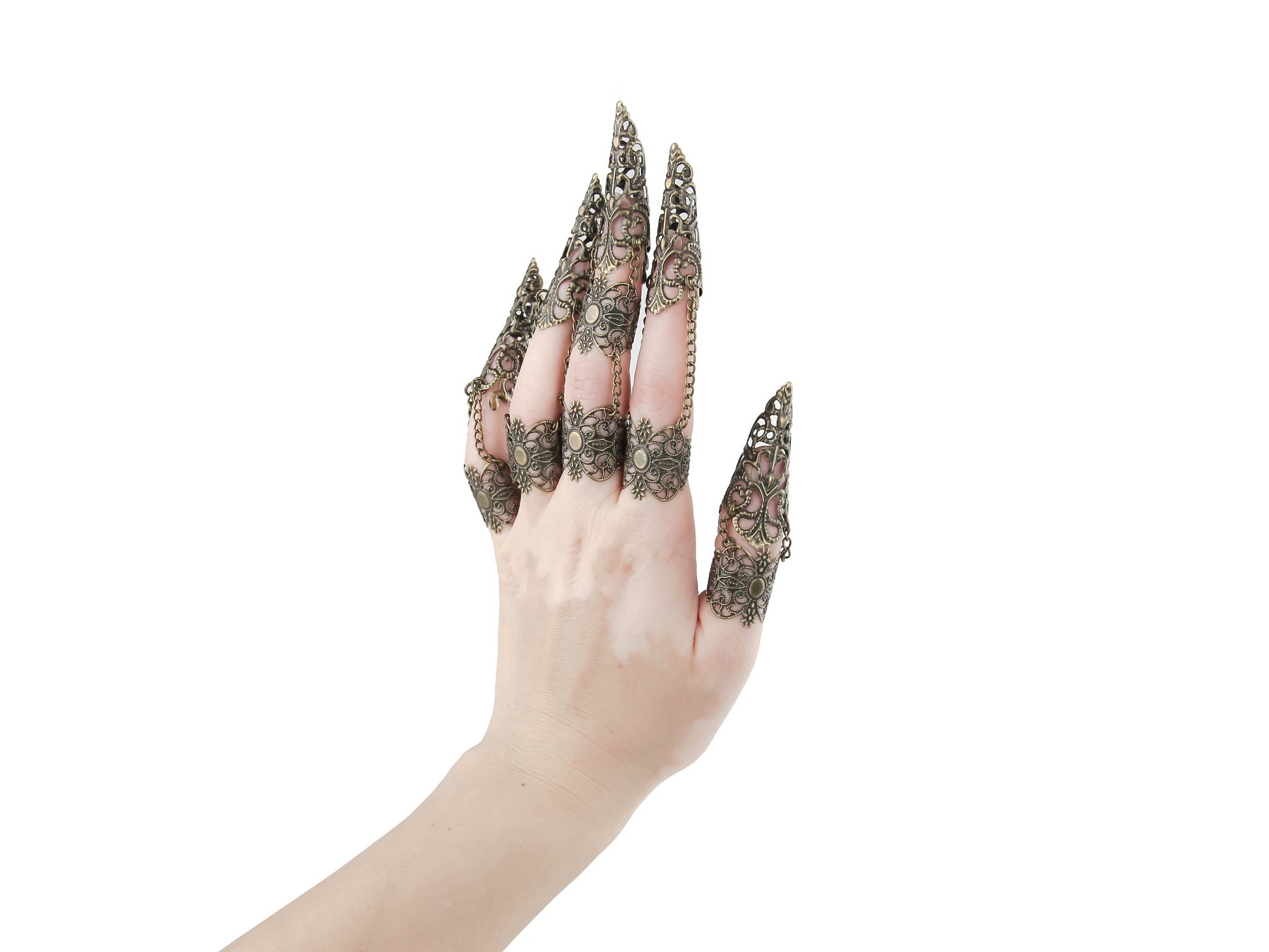 A striking set of bronze full-hand claw rings from Myril Jewels graces each finger with neo-goth intricacy. Designed for the dark-avantgarde and alternative style aficionado, these rings with claws are perfect for adding an edgy touch to Halloween or everyday minimal goth attire. The elaborate filigree work showcases the brand's commitment to gothic-chic elegance, making these claws a must-have for any witchcore, rave party, or festival jewel collection.