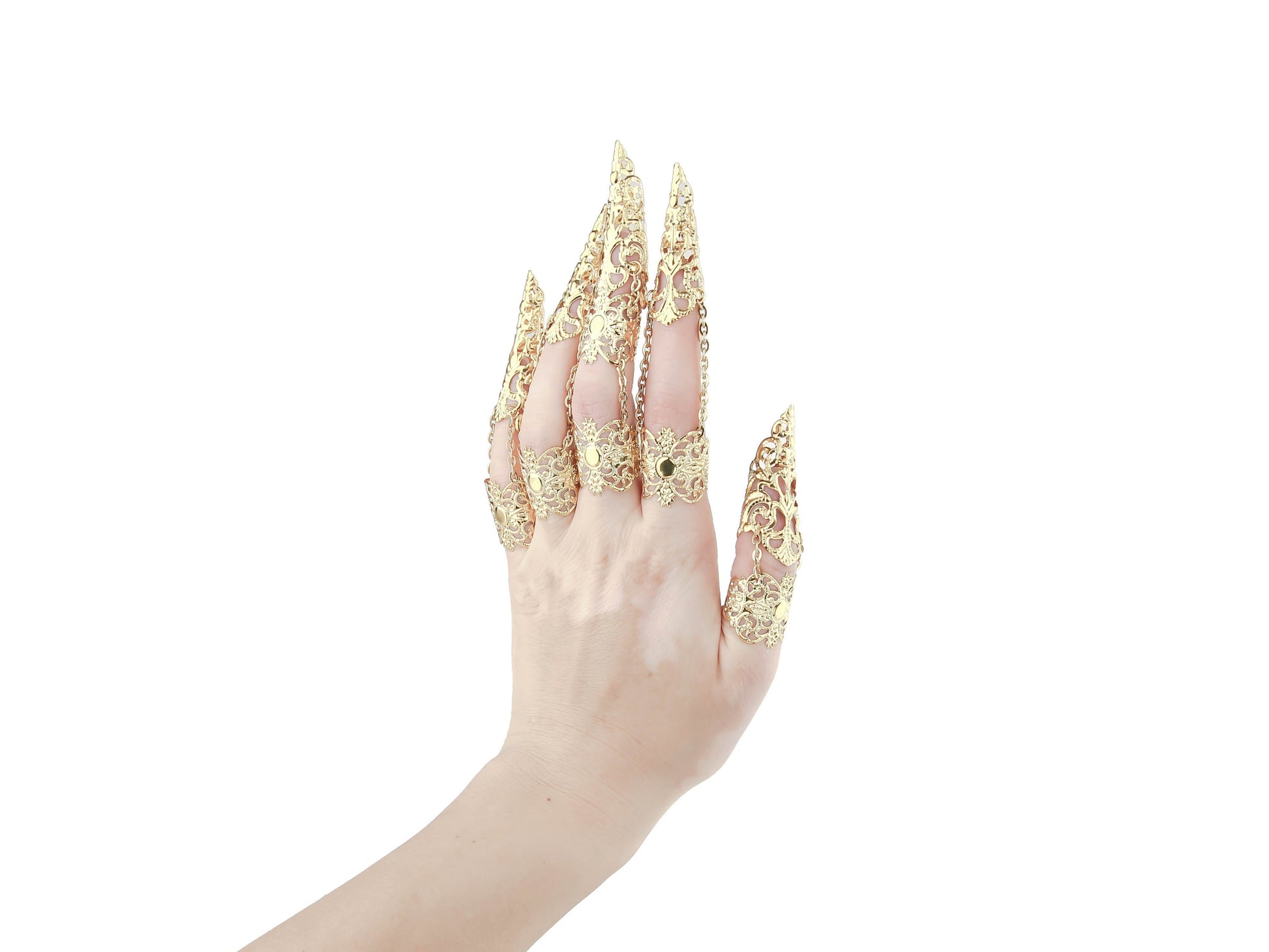 A hand is elegantly outfitted with a full set of Myril Jewels gold claw rings, showcasing a sophisticated neo-goth design. Each finger is graced with an ornate, gold filigree claw ring, exuding a dark-avantgarde and gothic-chic aesthetic. These lavish rings with claws are a perfect match for the alternative style lover, making a dramatic statement for Halloween, enhancing a minimal goth attire, or adding an edge to rave party and festival ensembles.