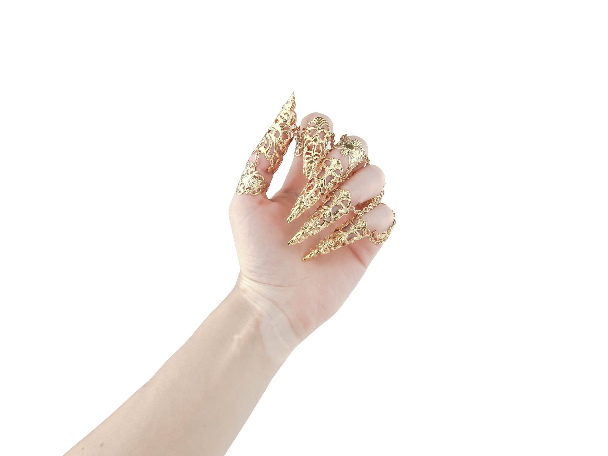 A hand is elegantly outfitted with a full set of Myril Jewels gold claw rings, showcasing a sophisticated neo-goth design. Each finger is graced with an ornate, gold filigree claw ring, exuding a dark-avantgarde and gothic-chic aesthetic. These lavish rings with claws are a perfect match for the alternative style lover, making a dramatic statement for Halloween, enhancing a minimal goth attire, or adding an edge to rave party and festival ensembles.