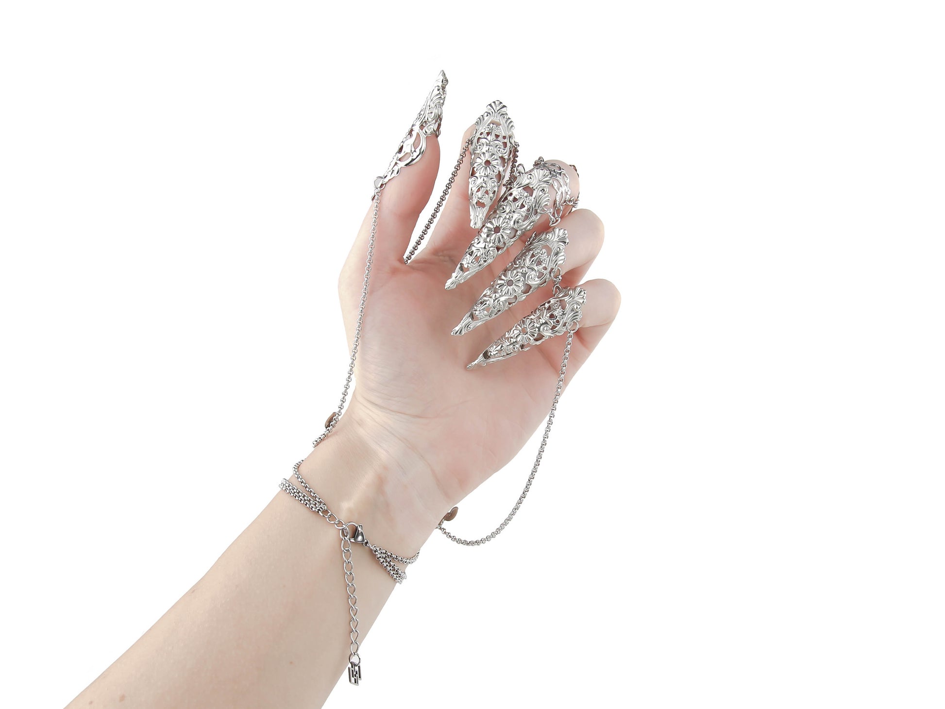 A hand adorned with a Myril Jewels chain bracelet with claws presents an image of neo-goth luxury. Perfect for gothic-chic aficionados and those seeking a unique addition to their Halloween or rave party jewelry collection, these claw rings make a bold statement.