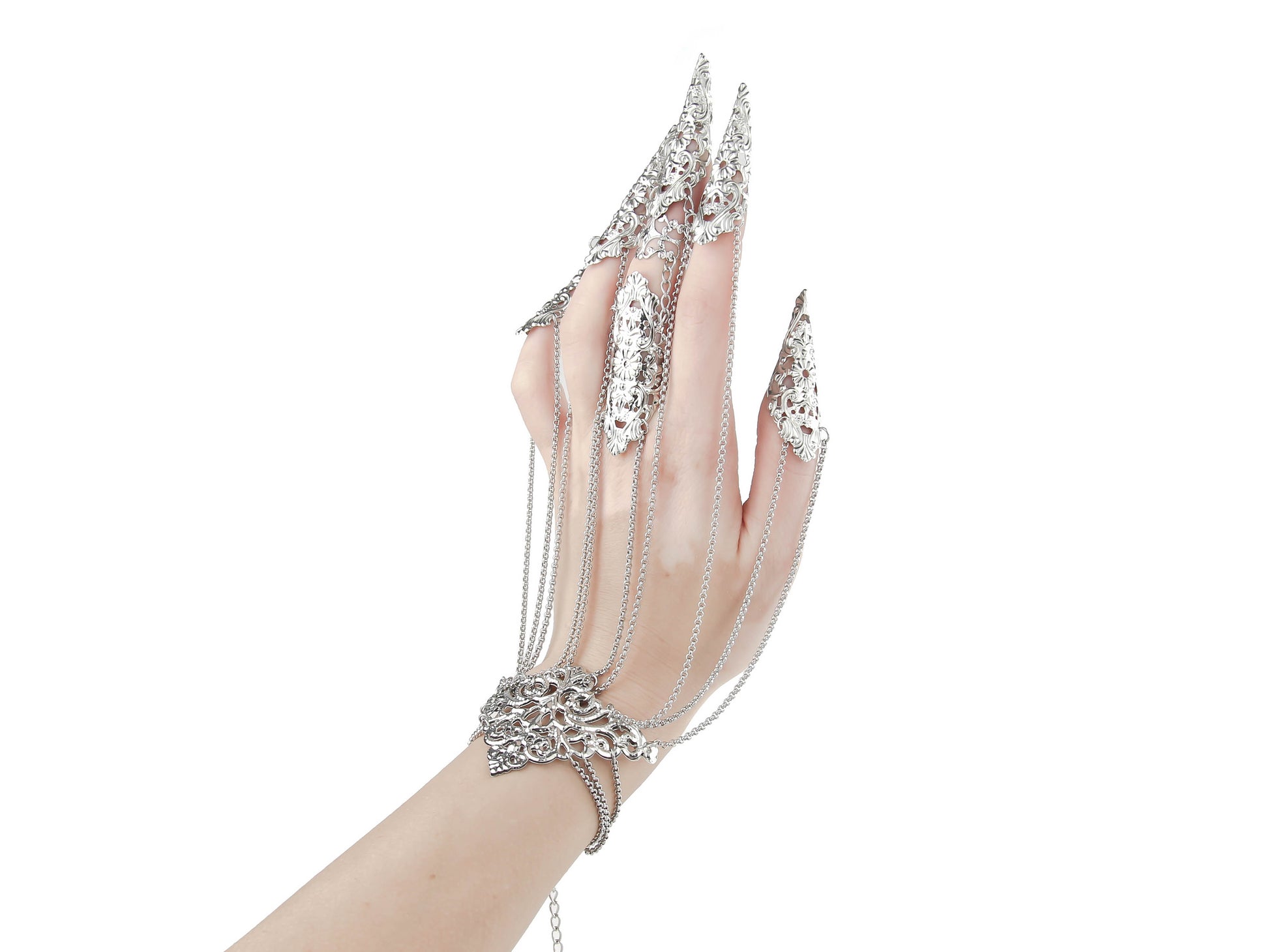 A hand adorned with a Myril Jewels chain bracelet with claws presents an image of neo-goth luxury. Perfect for gothic-chic aficionados and those seeking a unique addition to their Halloween or rave party jewelry collection, these claw rings make a bold statement.