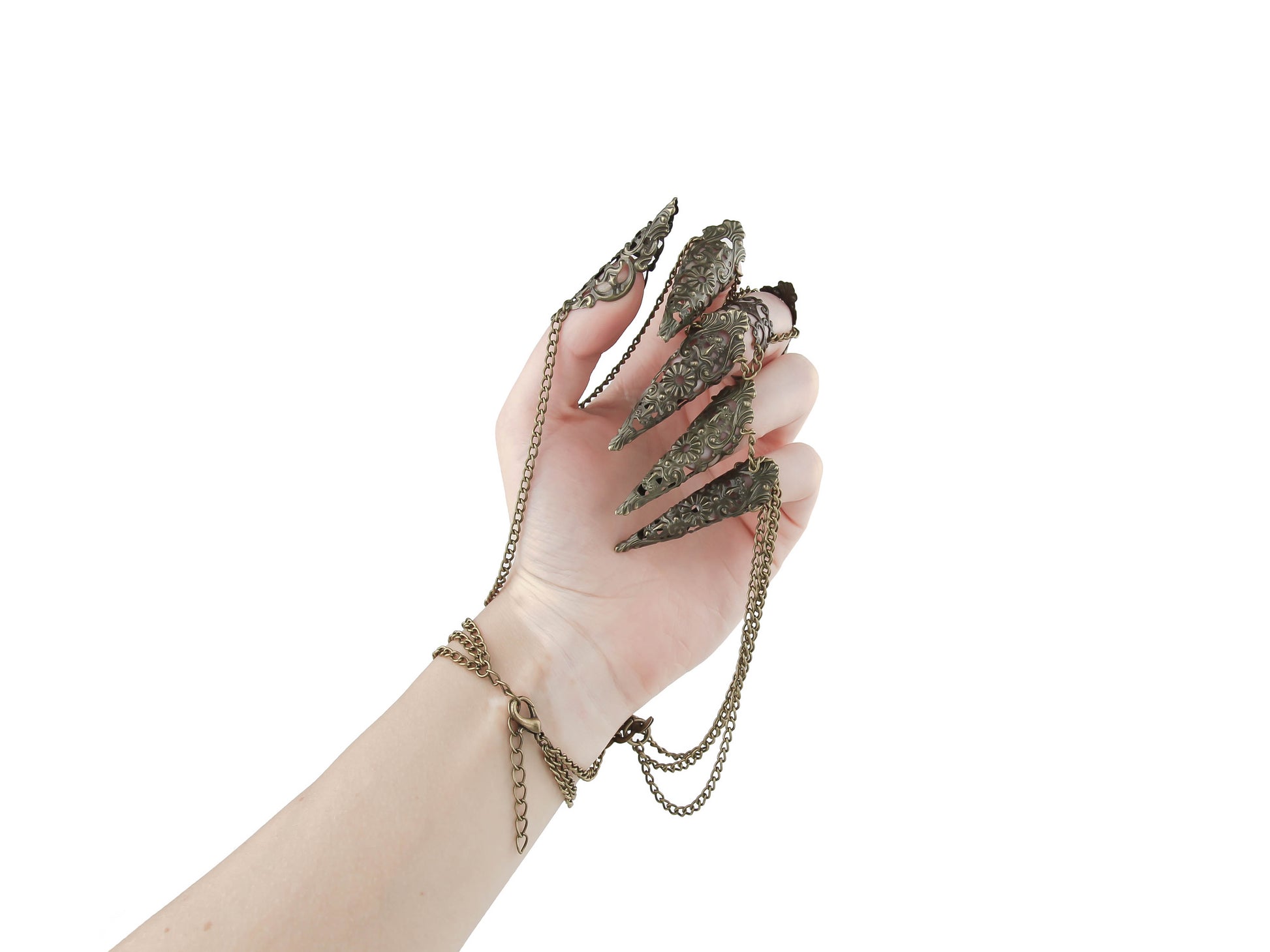 An elevated hand displays a striking Myril Jewels bronze hand chain bracelet with elaborate claws, fusing dark avant-garde with neo-gothic flair. Ideal for those who adore gothic-chic style, this piece adds a dramatic touch to any ensemble, be it for Halloween, festival wear, or as an everyday statement.