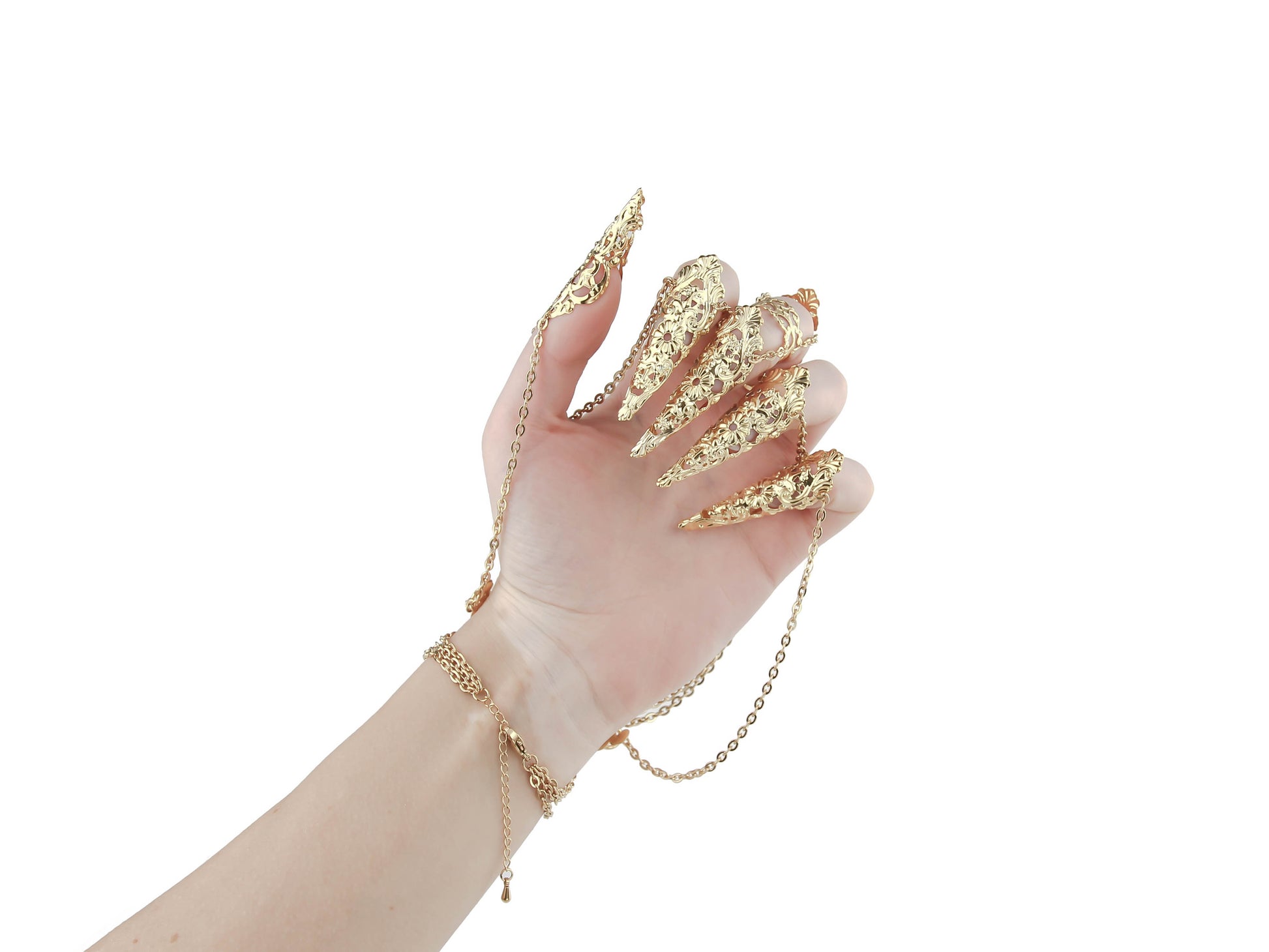 An elegant hand displays a Myril Jewels gold hand chain bracelet with intricate gold claws, epitomizing the neo-goth style. This piece is perfect for those who favor dark avant-garde accessories, blending Halloween and gothic-chic aesthetics for a unique statement in everyday or festival attire