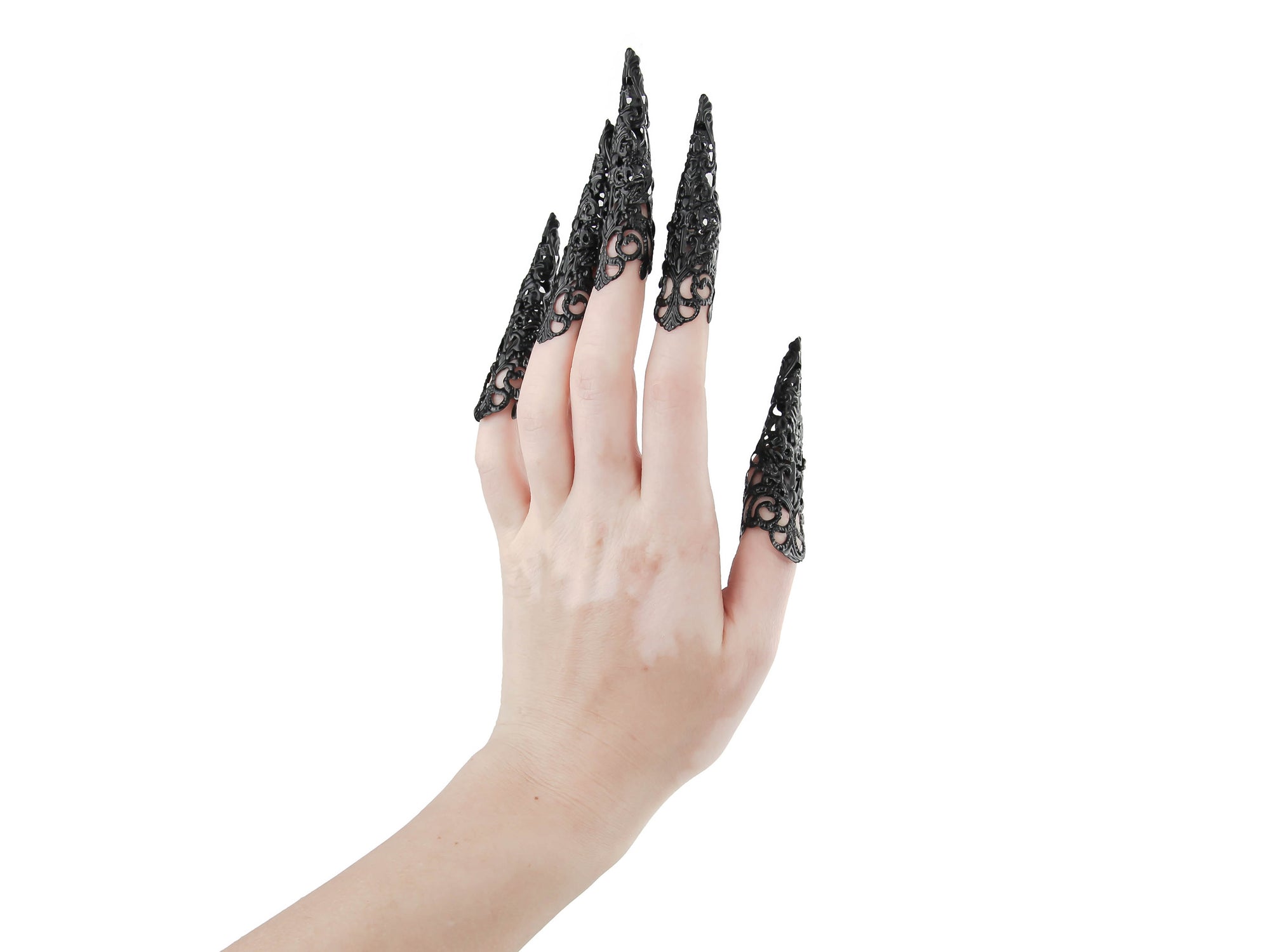 Captivating full hand set of Myril Jewels' extra long black nail claw rings showcased on a delicate hand. These neo-gothic claws are perfect for a dramatic goth-chic look, making a bold statement for Halloween, enhancing a rave party outfit, or as a memorable gift for the goth girlfriend with a love for dark avant-garde fashion.
