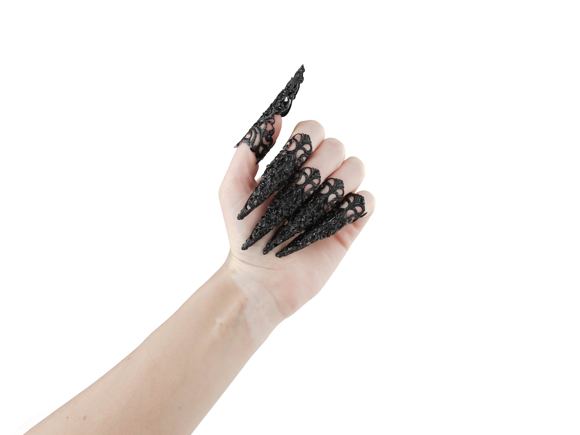 Captivating full hand set of Myril Jewels' extra long black nail claw rings showcased on a delicate hand. These neo-gothic claws are perfect for a dramatic goth-chic look, making a bold statement for Halloween, enhancing a rave party outfit, or as a memorable gift for the goth girlfriend with a love for dark avant-garde fashion.