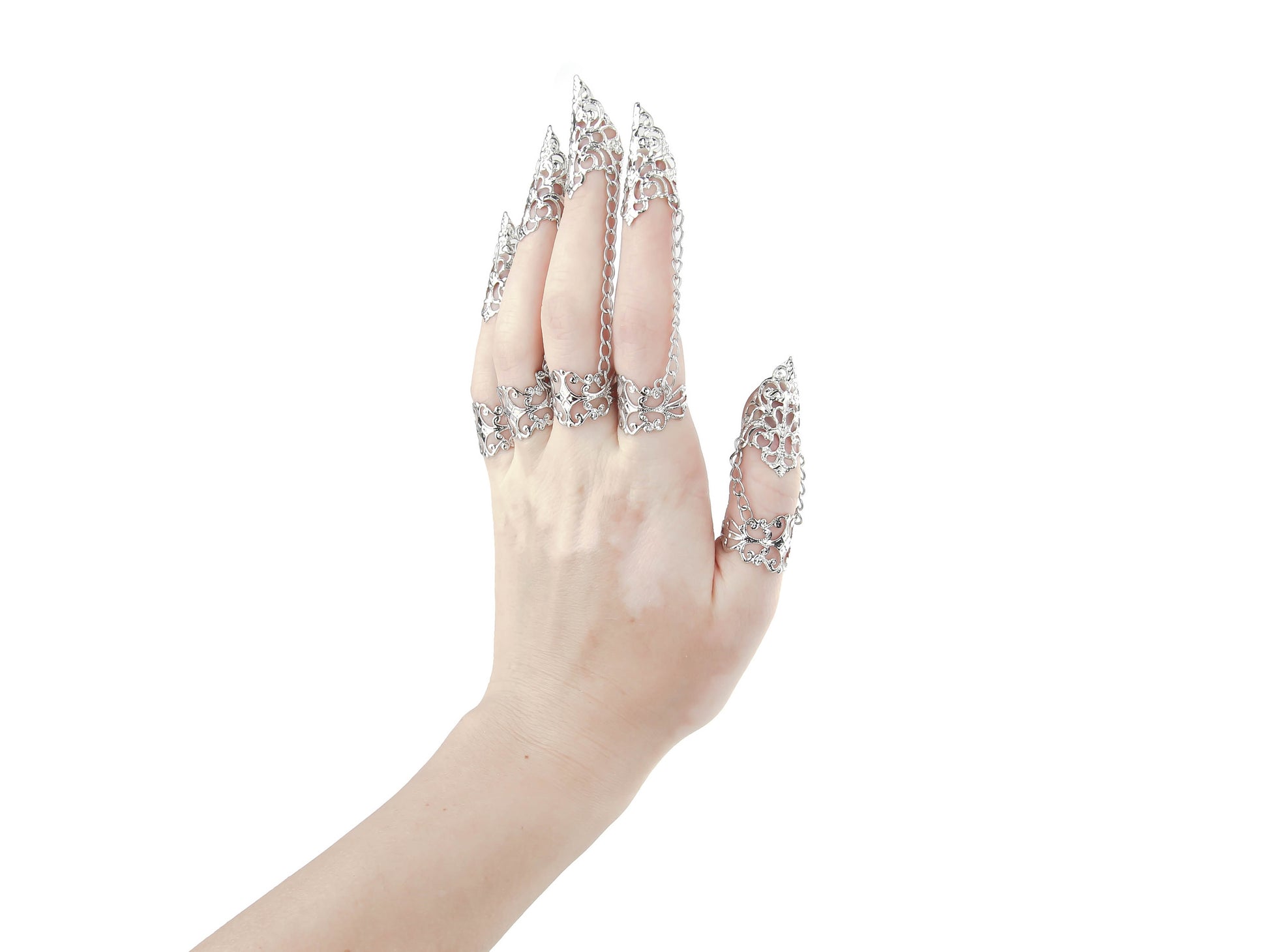  Displayed is a stunning full hand set of Myril Jewels claw rings, designed for the dark-avantgarde enthusiast. The rings feature intricate silver filigree that delicately wraps around each finger, culminating in sharp, claw-like tips, perfect for a Gothic-chic or Witchcore look. These handcrafted pieces are ideal for Halloween, adding a bold statement to minimal goth daily wear, and are a dazzling choice for rave party jewelry or festival adornment, reflecting the unique artistry of Neo Gothic jewels.