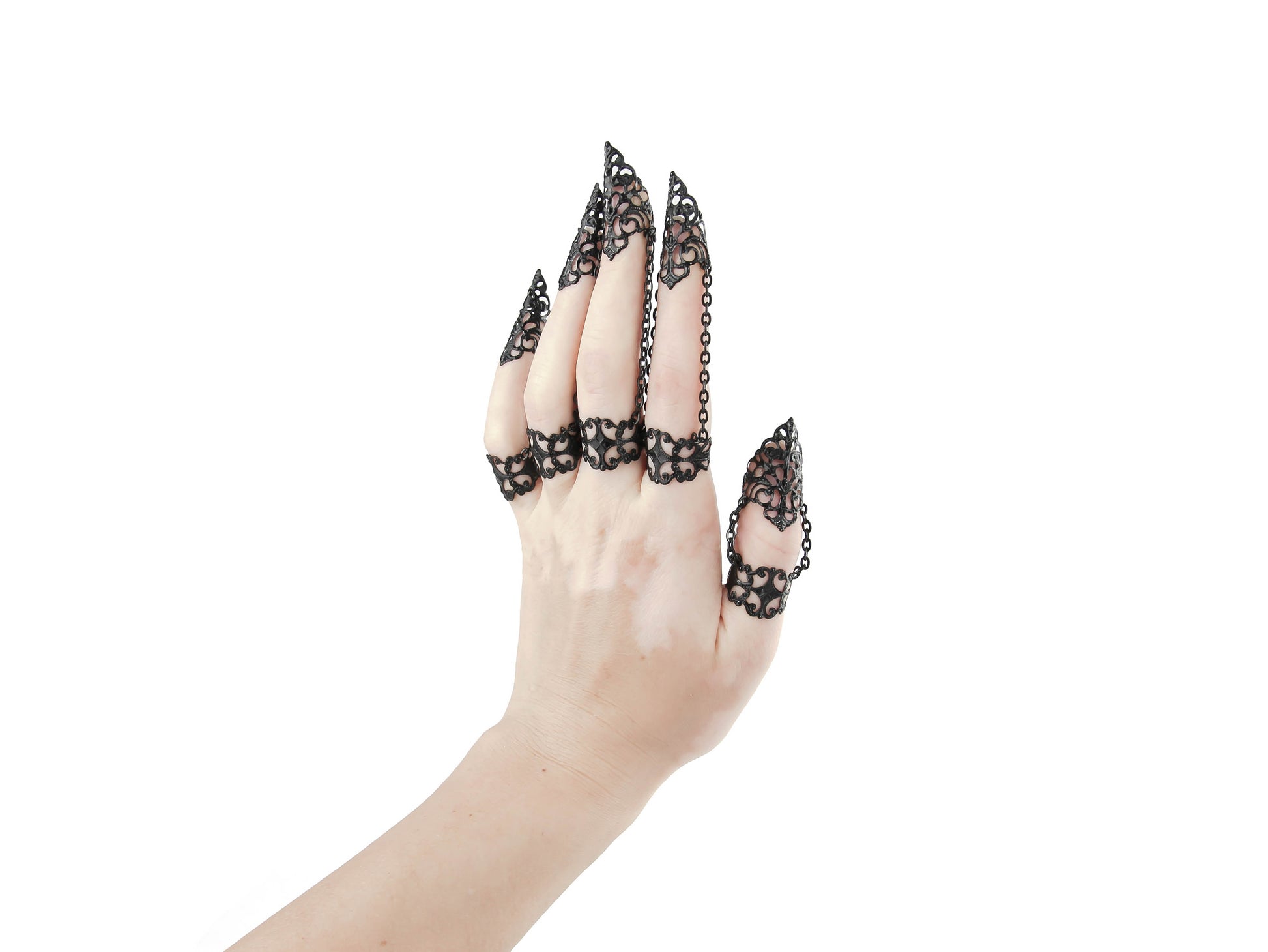  A sophisticated full hand set of Myril Jewels claw rings, exquisitely designed for the dark-avantgarde enthusiast. The intricate filigree work of the black rings creates a stunning contrast that captures the essence of Neo Gothic style. Ideal for gothic-chic attire, Witchcore ensembles, or as a striking addition to minimal goth daily wear. This set is a perfect choice for those seeking standout Halloween or festival jewelry, embodying the bold spirit of punk and rave party fashion