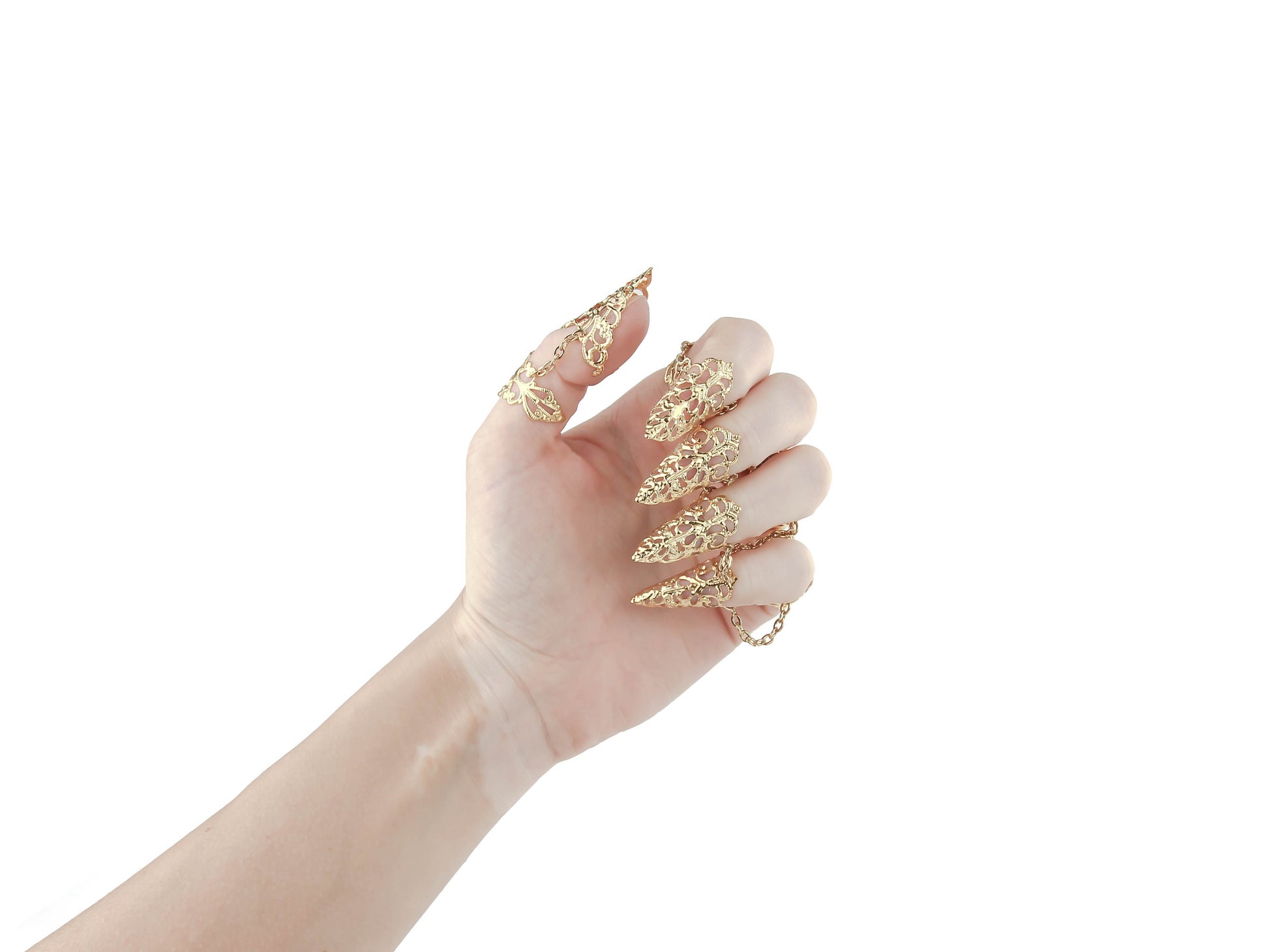 A hand elegantly displays Myril Jewels' full set of gold claw rings, each piece featuring ornate filigree designs that evoke Neo Gothic sophistication. Ideal for those with a love for Gothic-chic and dark-avantgarde aesthetics, this set complements Halloween outfits and adds an edge to everyday wear. It's a stunning choice for minimal goth enthusiasts or as standout rave party jewelry, capturing the Witchcore spirit and festival jewel trends