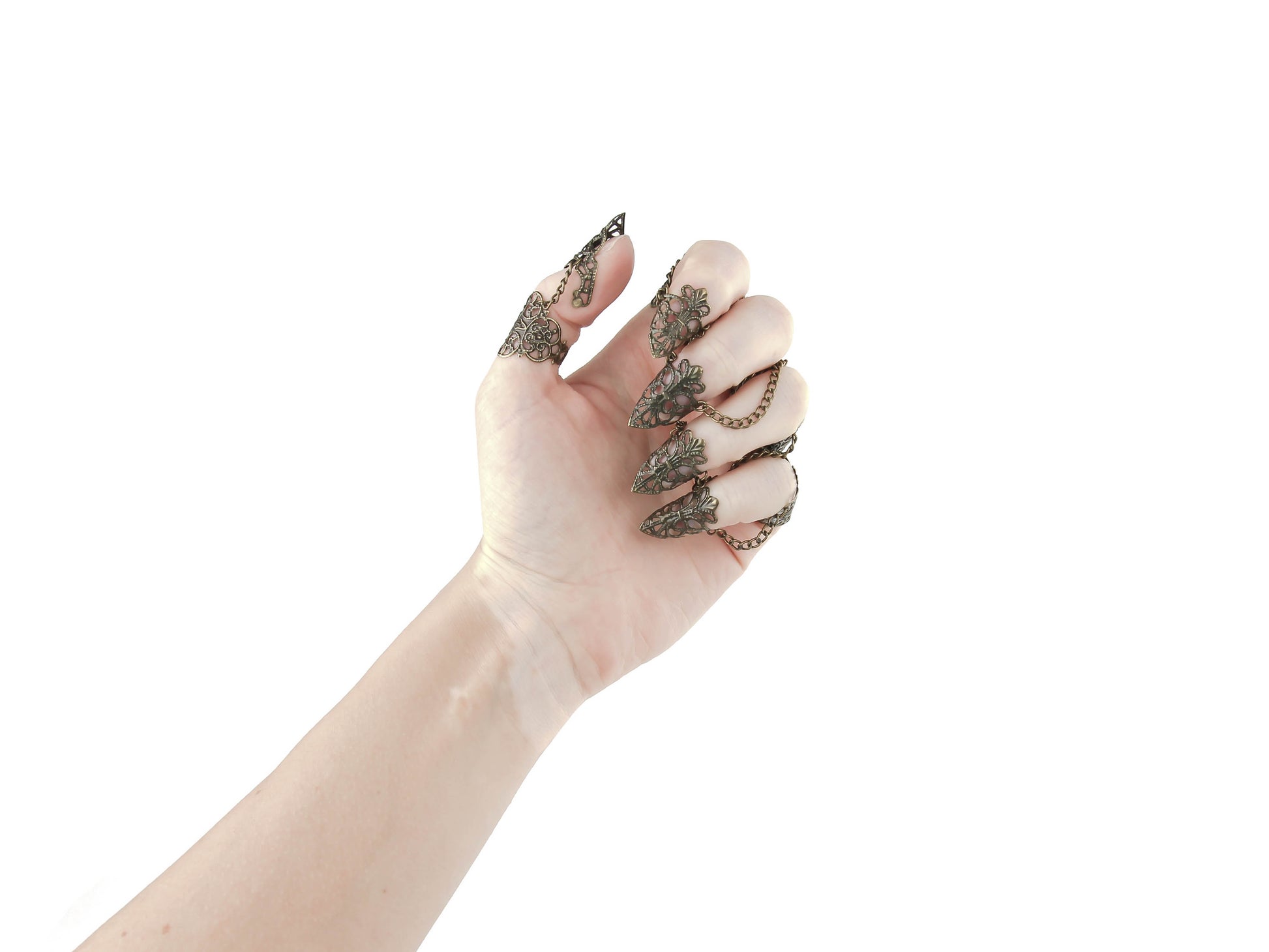 A hand elegantly displays Myril Jewels' full set of intricate bronze rings with nail claws, perfect for neo-gothic style enthusiasts. The exquisite craftsmanship is ideal for Halloween, punk fashion statements, or as a standout accessory for whimsigoth and witchcore looks, also making a memorable gift for a goth girlfriend.