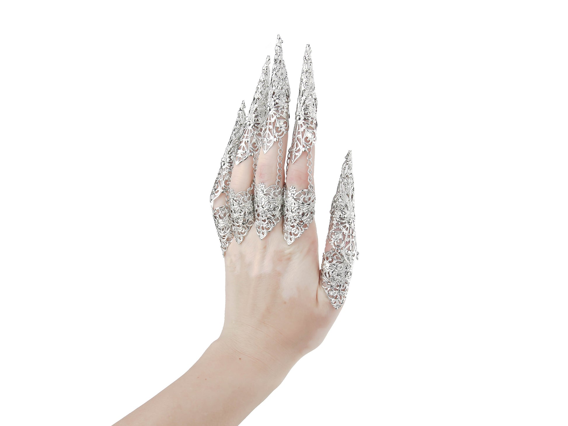 Captured is a full hand set of Myril Jewels claw rings, each piece flowing into long, slender claws that evoke the essence of neo-gothic design. These silver filigree rings, perfect for dark avant-garde enthusiasts, are an impeccable choice for enhancing Halloween attire, gothic-chic fashion, or making a bold statement at rave parties, festivals, or in a drag queen's dazzling ensemble.
