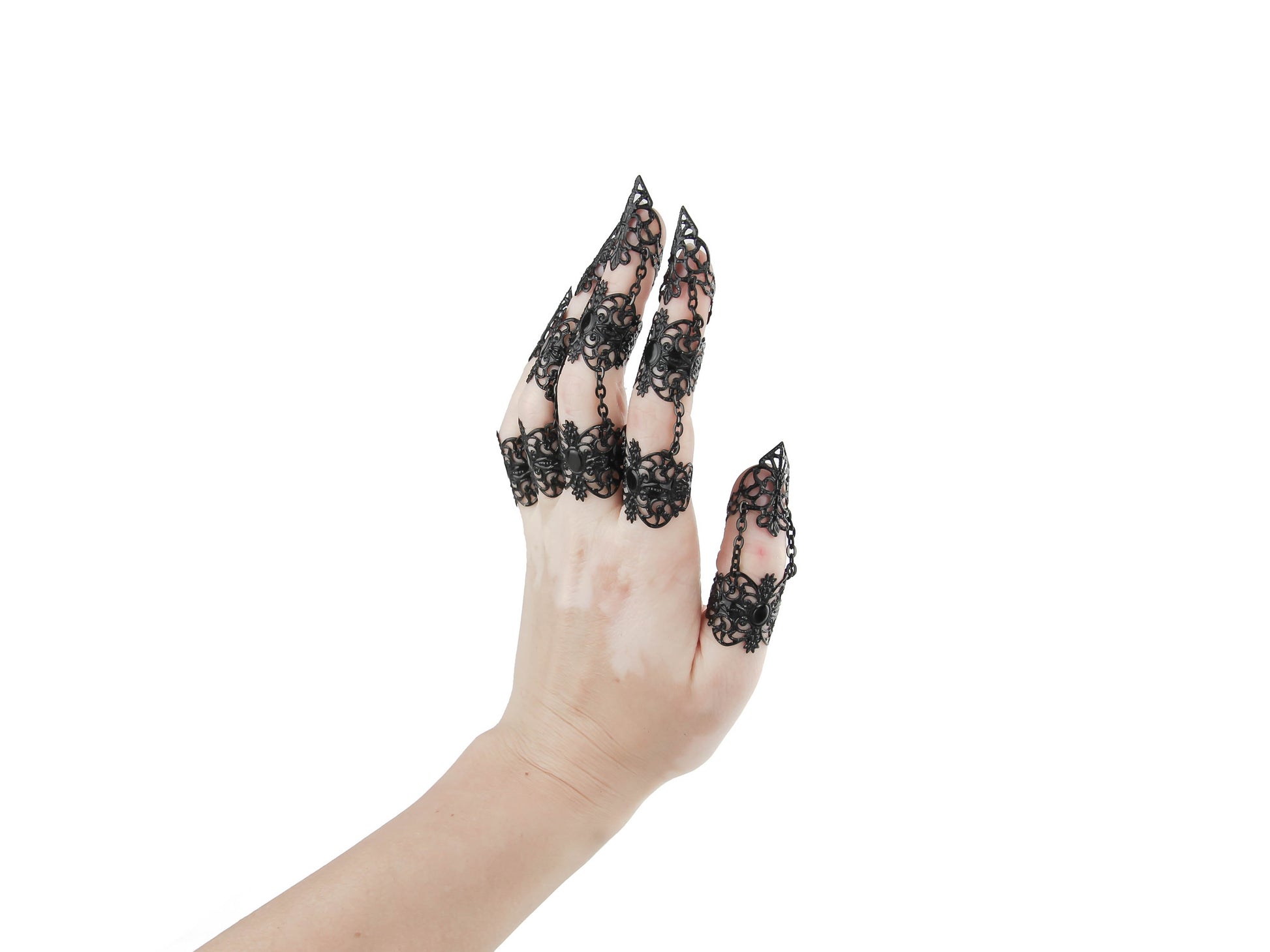A hand displays a full finger black claw ring set from Myril Jewels, crafted with exquisite detail for a striking neo-goth look. Ideal for lovers of gothic-chic and witchcore styles, these rings add a daring touch to any ensemble, perfect for Halloween, festivals, or as a bold statement piece in everyday goth fashion.