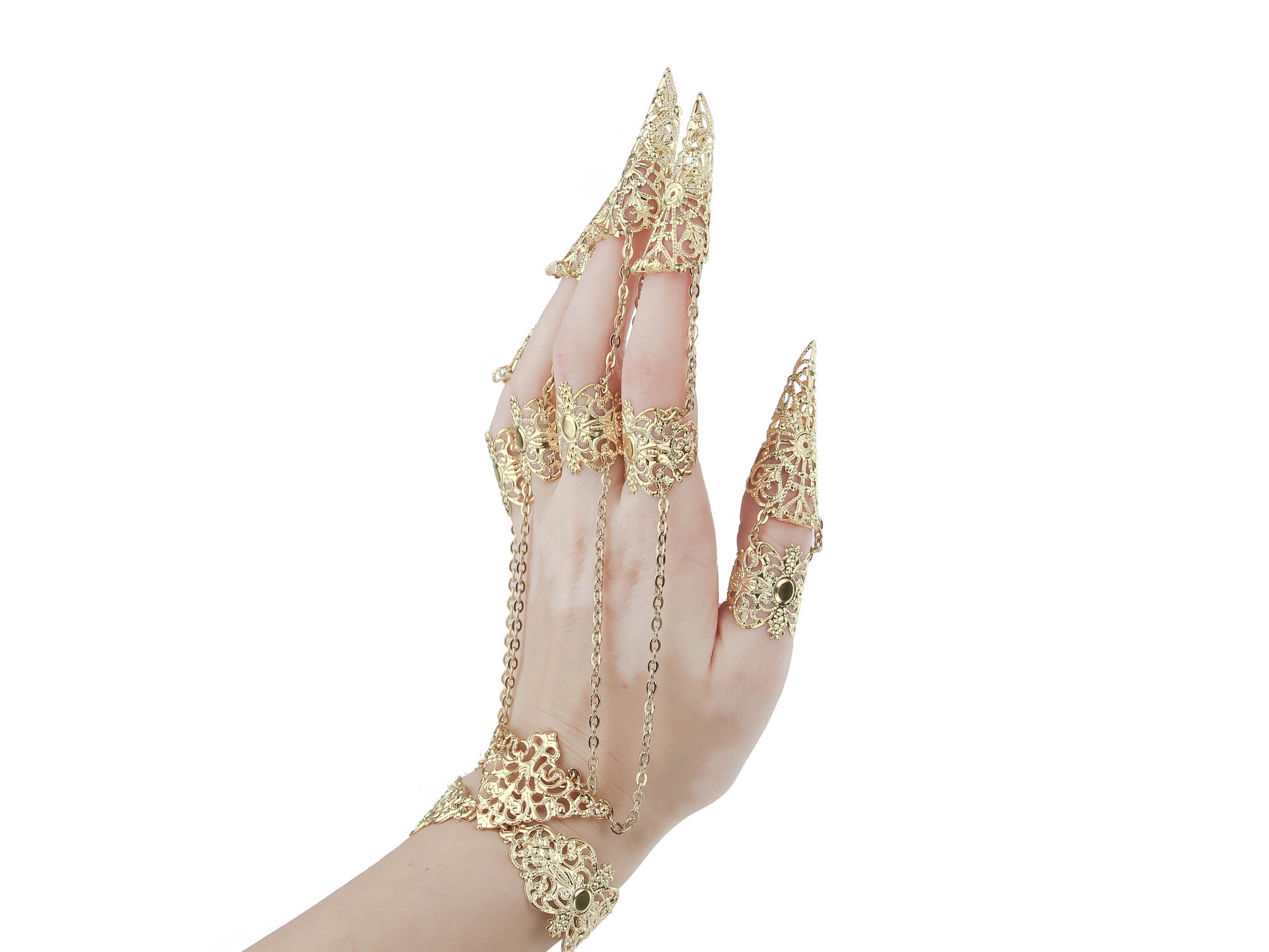 Elegant hand showcasing ornate gold jewelry with extended claw design, connected by delicate chains to the bracelet, embodying a bold gothic and witchy aesthetic ideal for statement accessorizing.