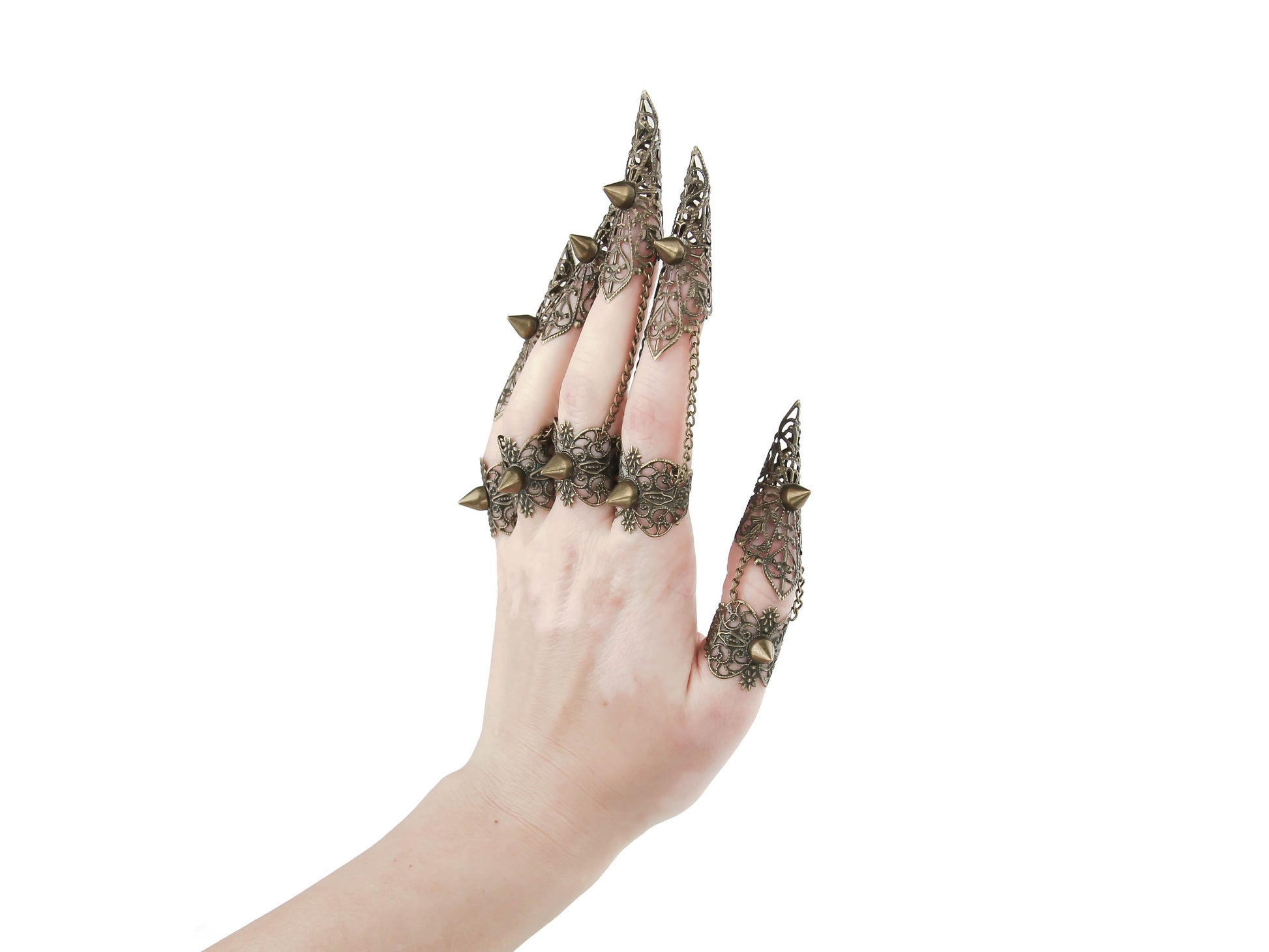 An artistic display of Myril Jewels' bronze claw rings with studs, capturing the essence of neo gothic design. These unique pieces embody the dark avant-garde, suitable for Halloween events, festival wear, or as a bold statement in a gothic-chic wardrobe