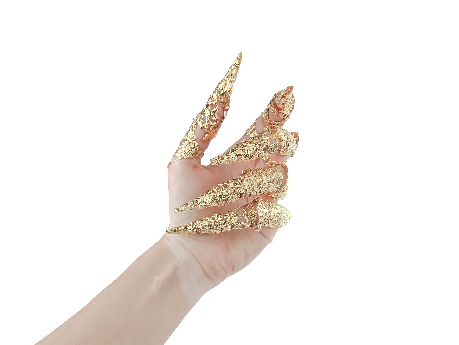 A hand dons an intricate set of full-finger gold claw rings with elongated nails, showcasing a neo goth aesthetic from Myril Jewels. These gold rings merge Halloween Jewelry and Neo Gothic Jewels influences, making a statement piece suitable for gothic-chic enthusiasts. Ideal for bold accessorizing, these rings serve as a striking goth girlfriend gift or a standout addition to festival jewels collections