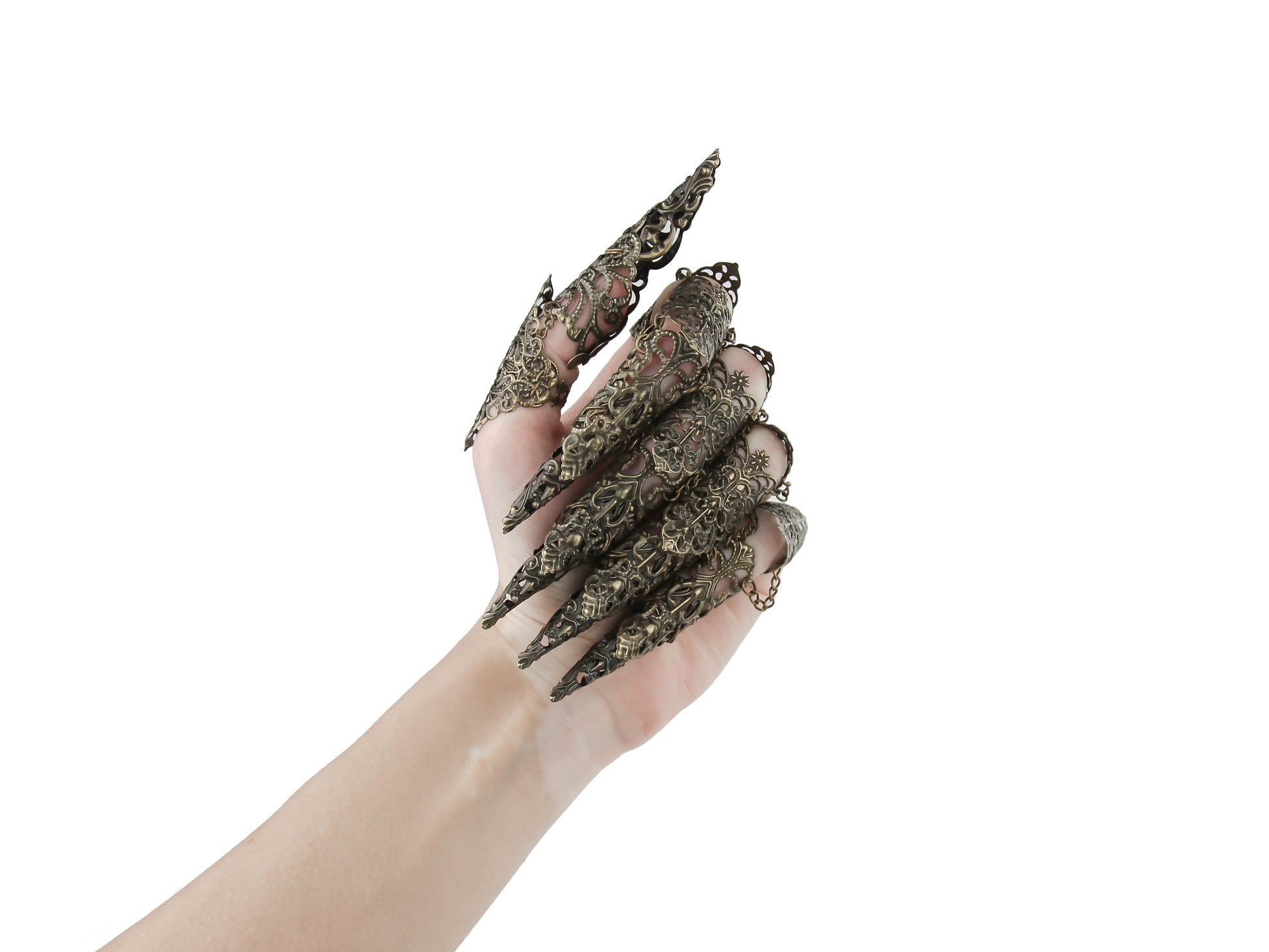 A hand adorned with a full set of bronze full-finger claw rings, designed by Myril Jewels, extends dramatically against a white backdrop. The intricate rings, resembling long nail claws, encapsulate a neo-gothic aesthetic, perfect for those who love bold, gothic-chic jewelry. Ideal for Halloween, festival occasions, or as a standout everyday accessory for the goth girlfriend or friend