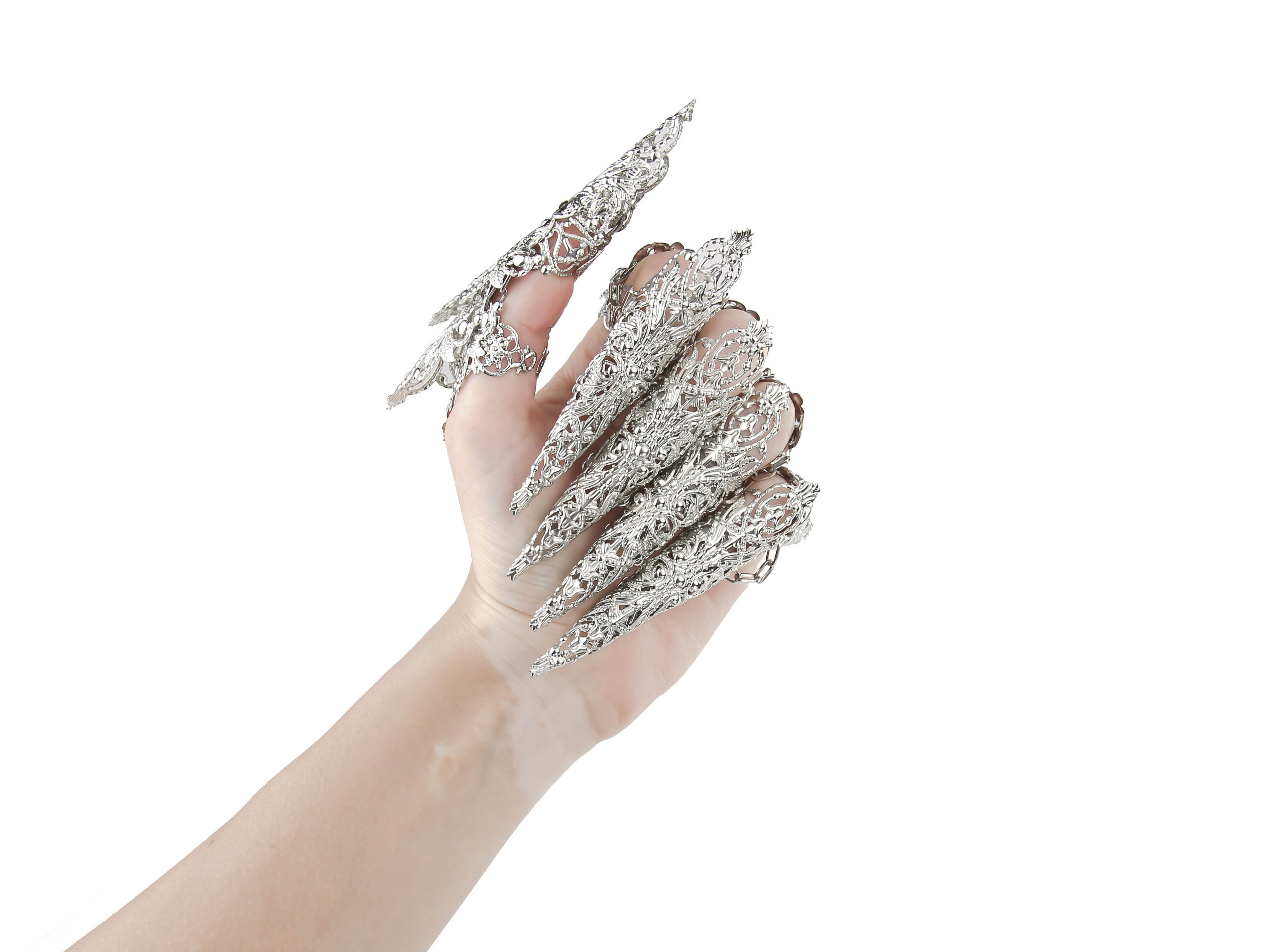 An alluring hand showcasing Myril Jewels' dragon-like claw rings set, with elaborate silver detailing perfect for gothic and alternative fashion enthusiasts. This neo-goth masterpiece is ideal for Halloween, a rave, or as an eye-catching everyday accessory for those who dare to stand out.