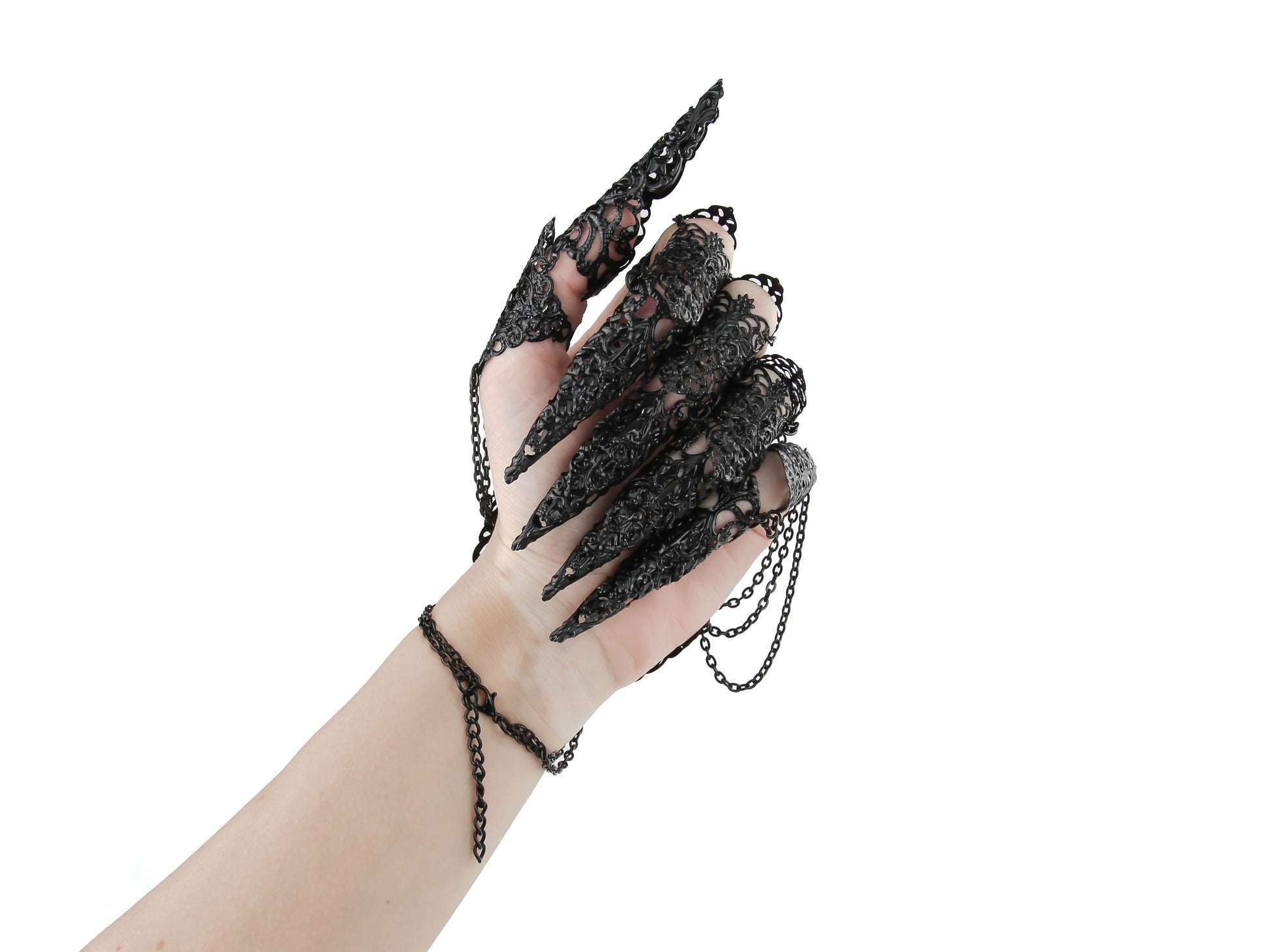 An almost closed hand dramatically showcases Myril Jewels' black lace finger armor, intertwined with chains, perfect for gothic-chic, neo-gothic, and whimsigoth styles. This handcrafted piece is a quintessential accessory for those who revel in witchcore aesthetics, making it an ideal selection for Halloween or punk fashion statements.