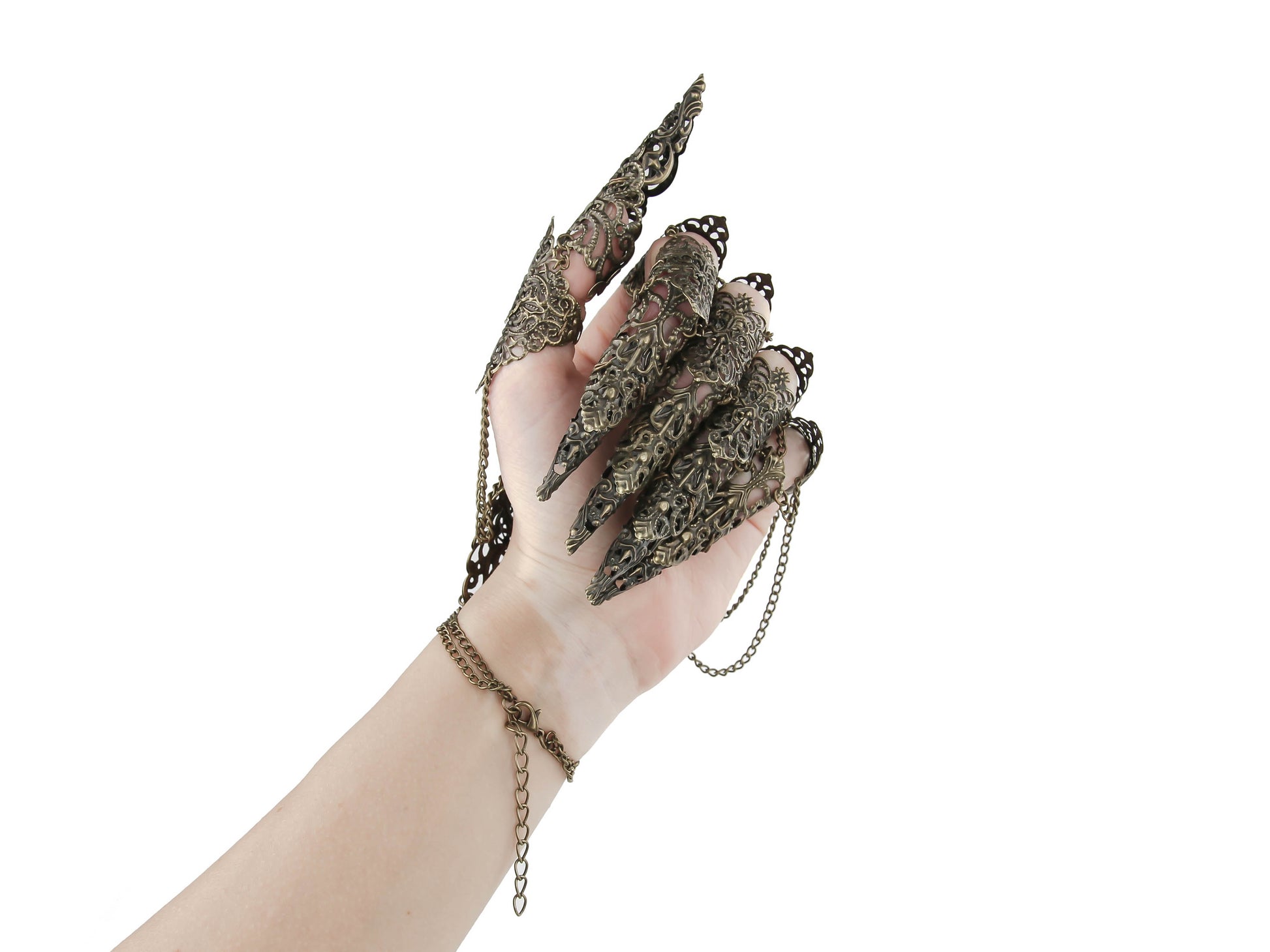An ethereal display of Myril Jewels' handcrafted bronze lace-like metal finger armor rings, perfect for gothic-chic, witchcore, and whimsigoth enthusiasts. These neo-gothic statement pieces are interconnected with delicate chains, ideal for Halloween or any punk-inspired fashion statement, showcasing the unique artistry of alternative style jewelry.