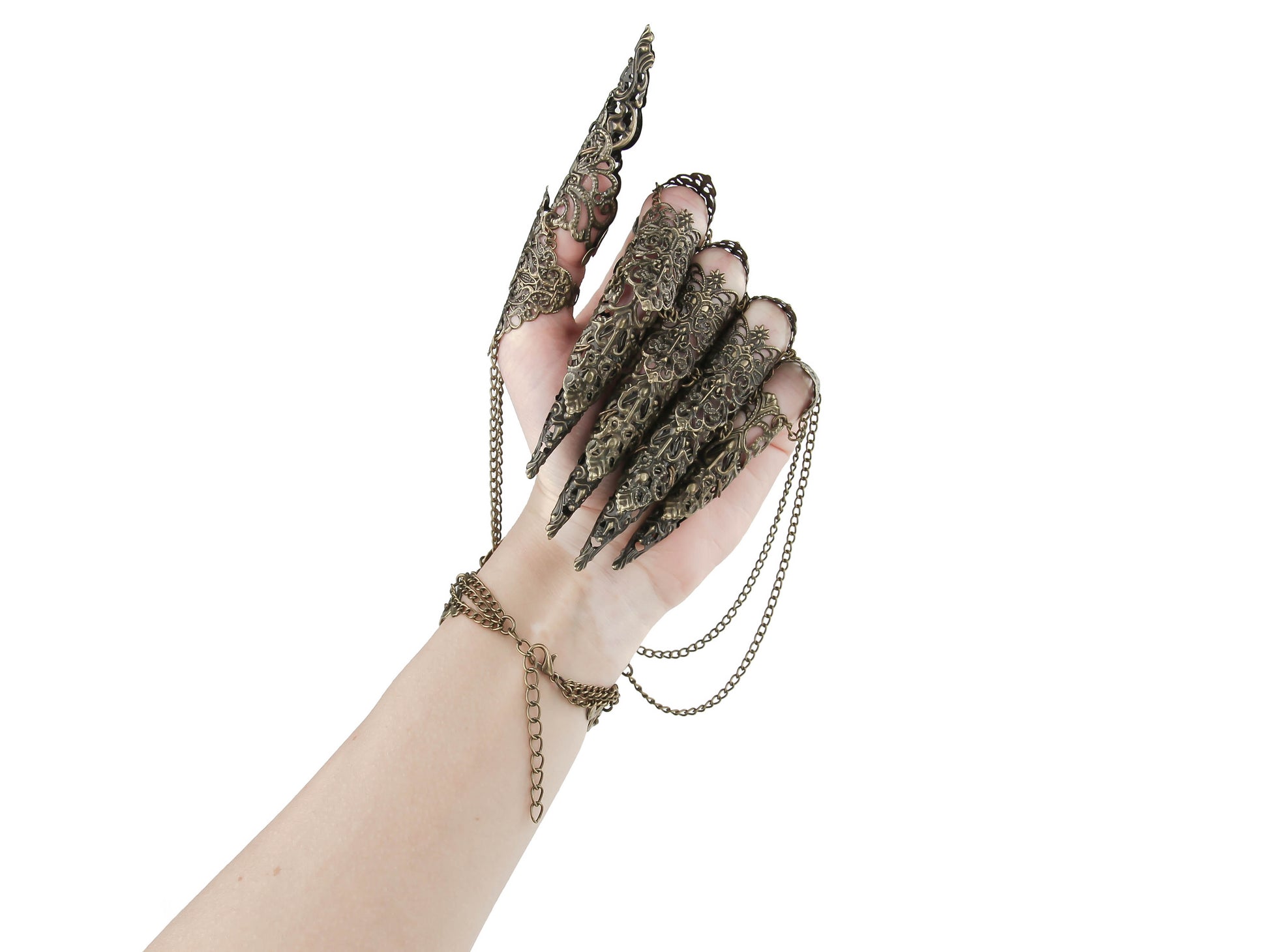 A hand dons a Myril Jewels bronze metal glove with long full finger claw rings, creating a stunning neo-gothic statement. This bold accessory, designed for the dark avant-garde enthusiast, is ideal for adding a whimsical yet edgy touch to gothic-chic, witchcore, or minimal goth attire.