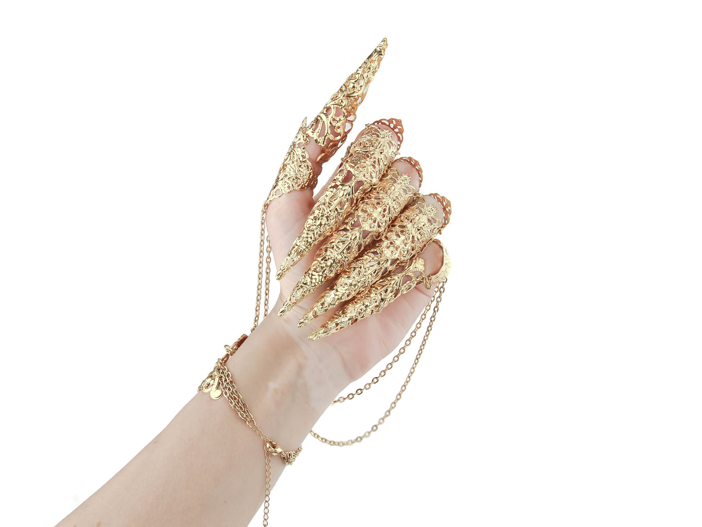 An exquisite gold metal glove with long full finger claw rings from Myril Jewels, perfect for a bold neo-goth statement. This avant-garde piece is an essential accessory for gothic, whimsigoth, and witchcore enthusiasts, and makes for an unforgettable gift for the goth girlfriend or a standout festival look.