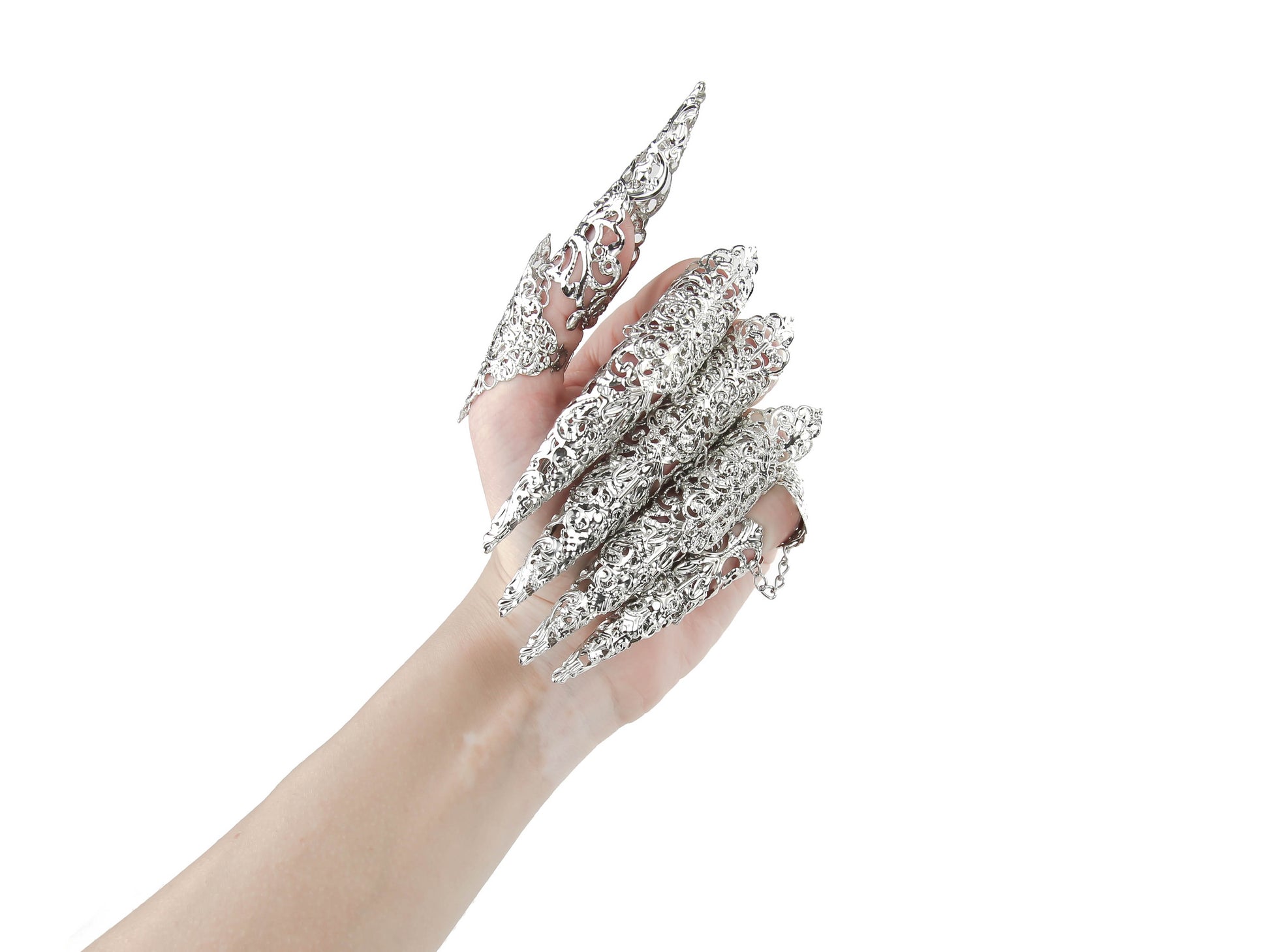 A hand is adorned with Myril Jewels' midi rings, featuring delicate filigree and extended claws. This bold jewelry embodies the dark, avant-garde essence, perfect for neo-gothic or minimal goth fashion statements and Witchcore enthusiasts