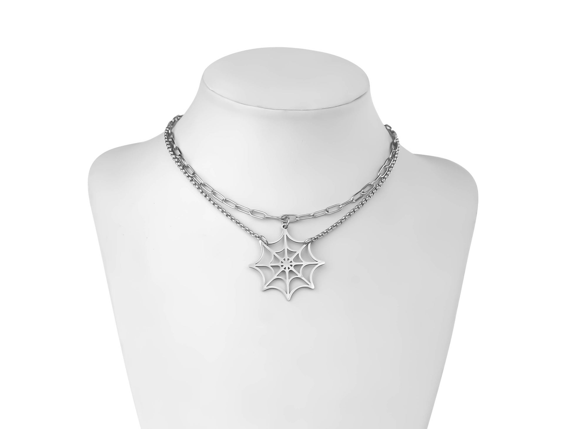 Displayed on a mannequin, a Myril Jewels chain necklace features a spiderweb pendant, merging neo-gothic style with whimsigoth delicacy. It's a striking accessory suitable for Halloween, rave parties, or as a distinctive everyday wear piece for lovers of gothic-chic and dark-avantgarde jewelry.