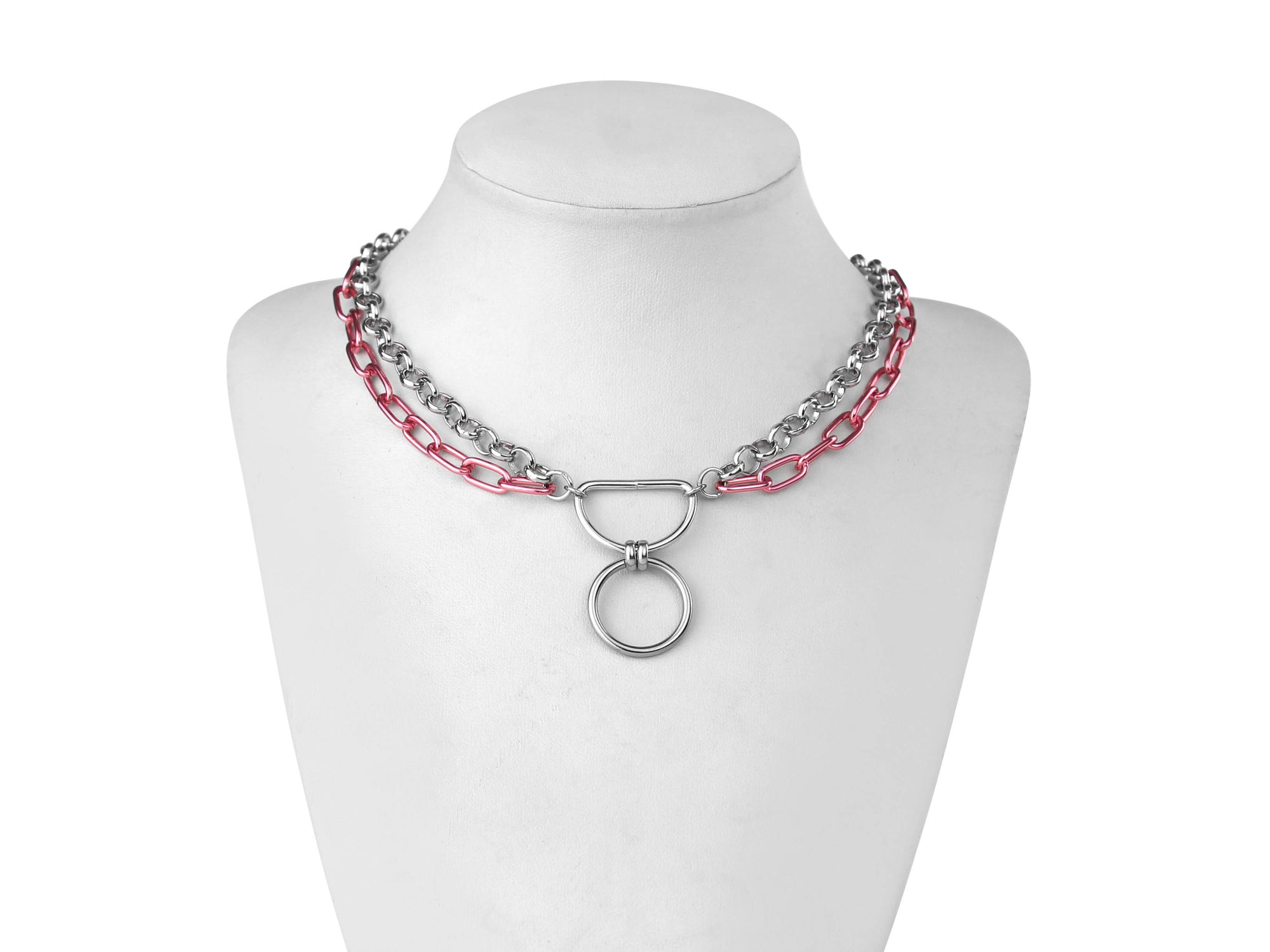 A Myril Jewels gothic punk necklace composed of alternating silver and vibrant pink chains features a prominent O-ring, exuding a mix of punk bravado and dark elegance. Ideal for Halloween adornment or daily wear, it's a statement piece for those with a taste for neo-gothic flair and avant-garde style.