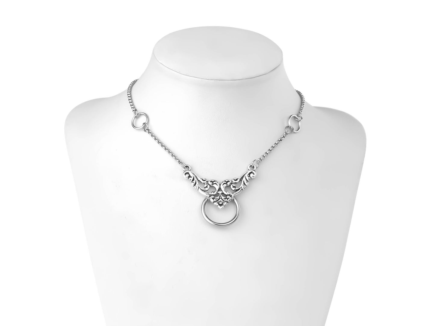 An elegant Myril Jewels chain choker graces a mannequin's neck, featuring intricate floral motifs and a central o-ring. This piece embodies neo-gothic sophistication, perfect for those who appreciate gothic-chic jewelry, and versatile enough for everyday wear, festivals, or as a thoughtful goth girlfriend gift.