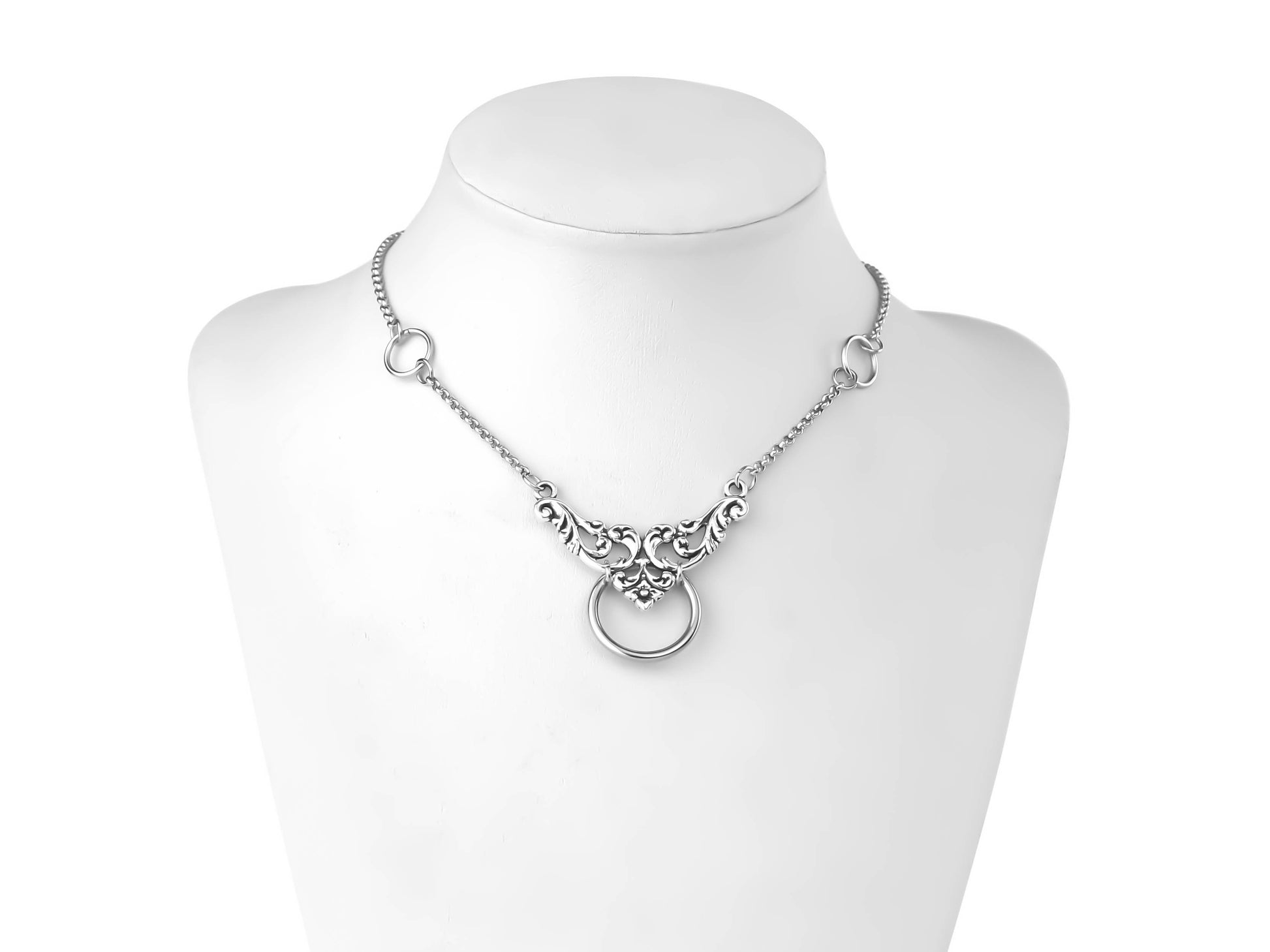 An elegant Myril Jewels chain choker graces a mannequin's neck, featuring intricate floral motifs and a central o-ring. This piece embodies neo-gothic sophistication, perfect for those who appreciate gothic-chic jewelry, and versatile enough for everyday wear, festivals, or as a thoughtful goth girlfriend gift.