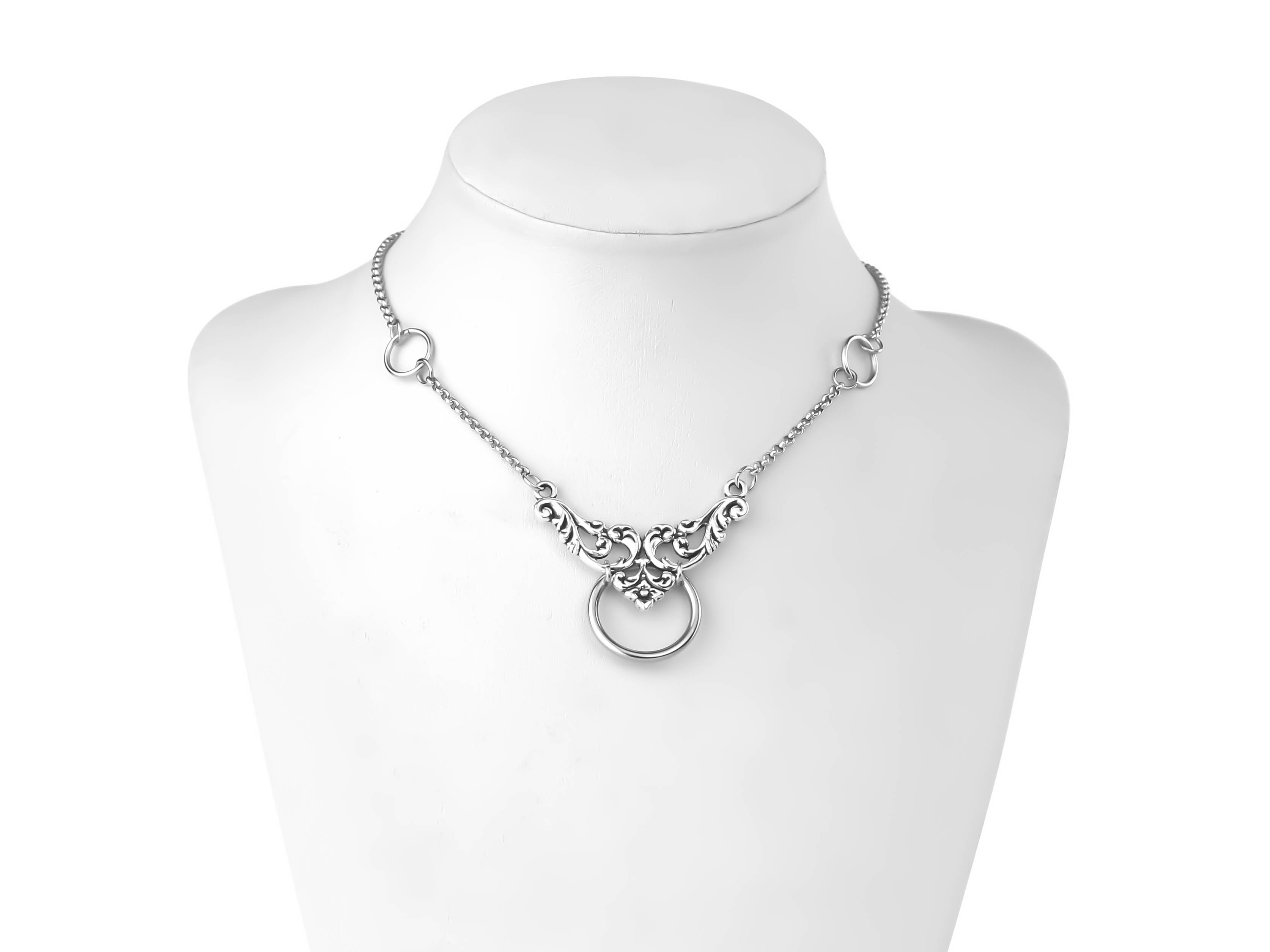 An elegant Myril Jewels chain choker graces a mannequin's neck, featuring intricate floral motifs and a central o-ring. This piece embodies neo-gothic sophistication, perfect for those who appreciate gothic-chic jewelry, and versatile enough for everyday wear, festivals, or as a thoughtful goth girlfriend gift.
