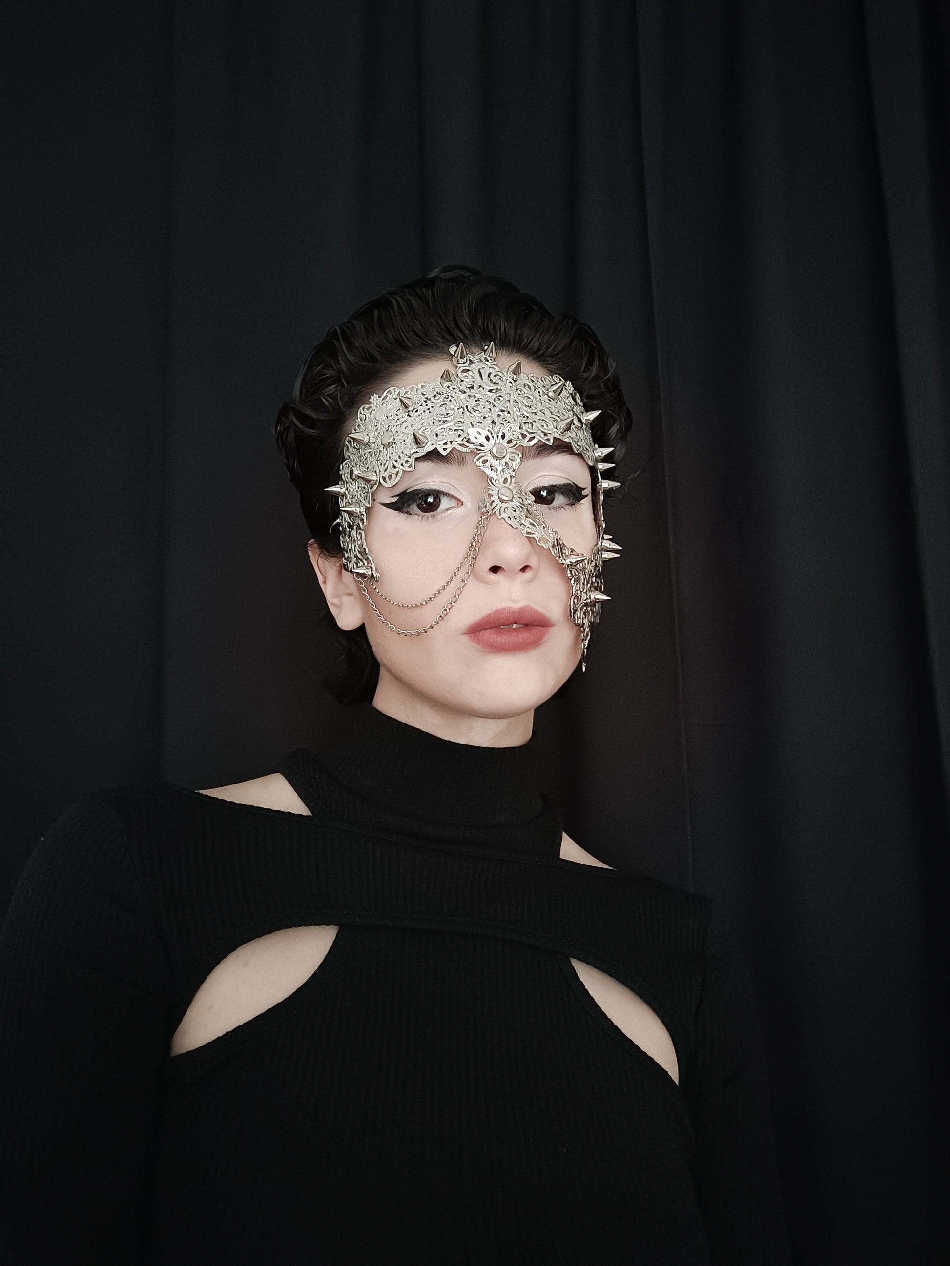 Embrace the allure of dark-avantgarde with Myril Jewels' handcrafted metal filigree mask, a perfect blend of Neo Gothic sophistication and Witchcore mystique. This intricate piece is ideal for Gothic-chic enthusiasts and makes a statement accessory for Halloween or any Punk-inspired event.