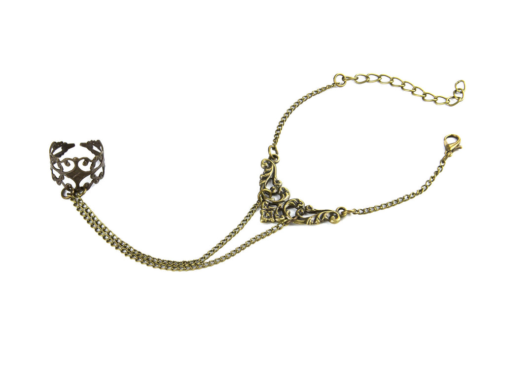 Unveil the essence of dark elegance with Myril Jewels' hand chain bracelet ring, a fusion of Punk Jewelry and Neo Gothic design. This handcrafted piece features intricate filigree forming a delicate ring that transitions into a bold, statement chain bracelet. Ideal for Gothic-chic aficionados and Witchcore enthusiasts, it's a versatile accessory for Halloween, rave parties, or as a distinctive touch to everyday minimal goth and festival outfits