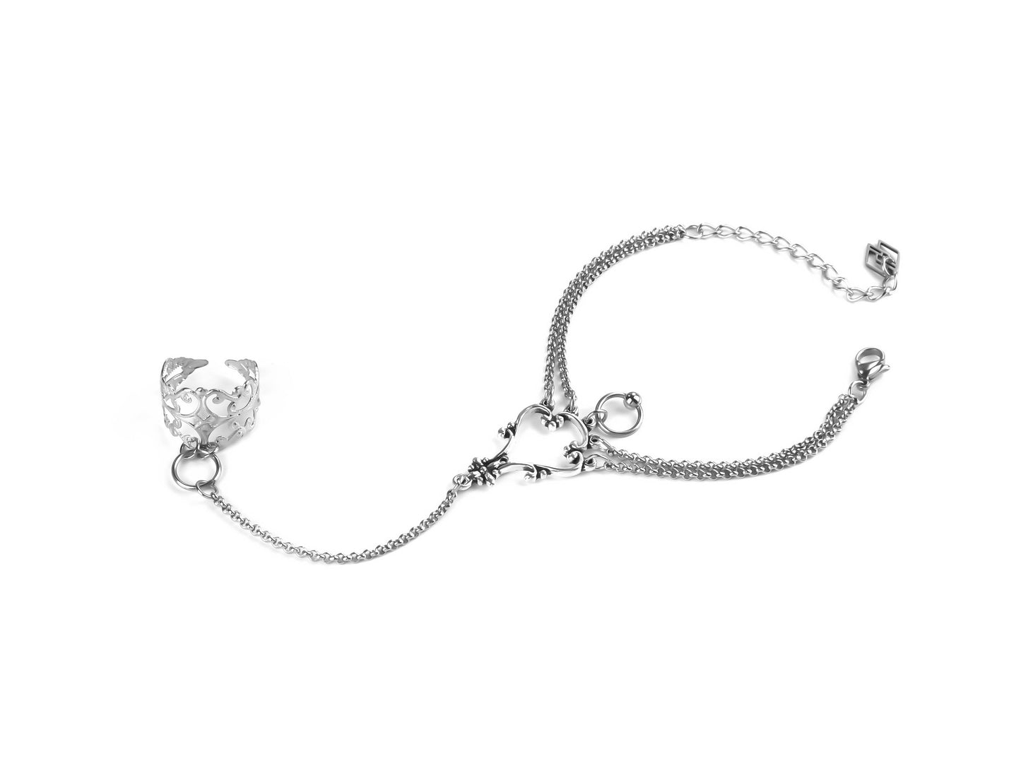 This Myril Jewels slave bracelet features a silver filigree ring connected to a matching wrist chain, reflecting the intricate design ethos of dark-avantgarde jewelry.