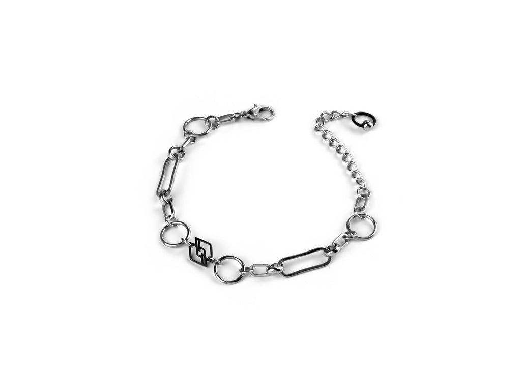 A sophisticated Myril Jewels chain-style bracelet, meticulously crafted for an edgy dark-avantgarde appeal. This sleek, silver-toned piece blends gothic-chic and Neo Gothic elements, perfect for those with a penchant for Gothic Lolita, Punk, or Witchcore aesthetics. A versatile accessory from Myril Jewels, it's suited for Halloween, everyday wear, and makes a bold statement in any alternative jewelry collection