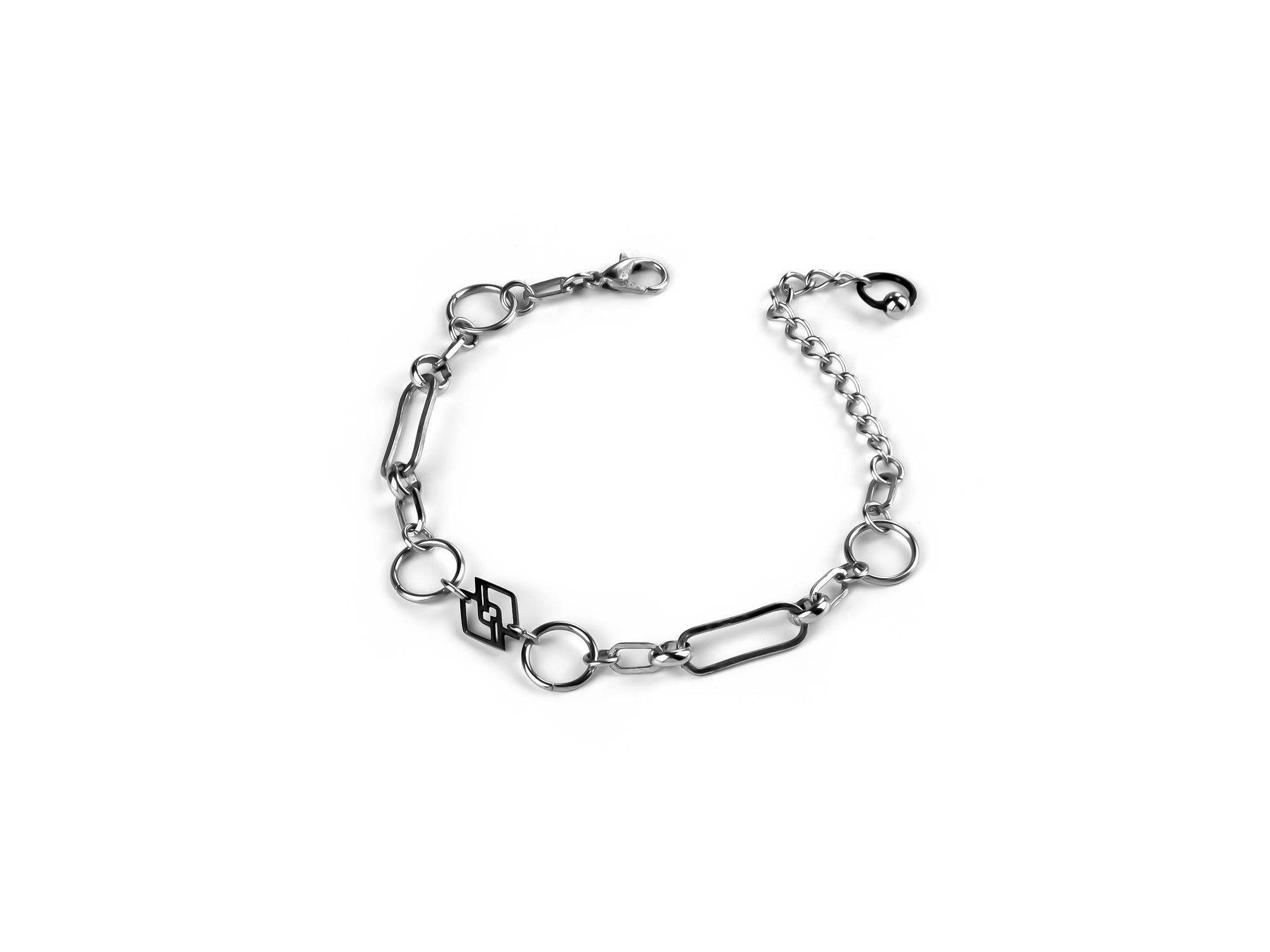 A sophisticated Myril Jewels chain-style bracelet, meticulously crafted for an edgy dark-avantgarde appeal. This sleek, silver-toned piece blends gothic-chic and Neo Gothic elements, perfect for those with a penchant for Gothic Lolita, Punk, or Witchcore aesthetics. A versatile accessory from Myril Jewels, it's suited for Halloween, everyday wear, and makes a bold statement in any alternative jewelry collection