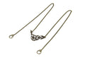 Elegant Myril Jewels bronze nose chain, with a detailed filigree design, exuding neo-gothic charm, set against a pure white background, perfect for gothic-chic fashion statements