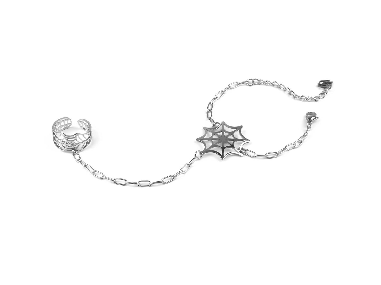 Enhance your style with Myril Jewels' hand chain bracelet ring, showcasing a unique spiderweb design. Ideal for adding a touch of neo-goth flair to any outfit, especially as a statement piece for Halloween or within a gothic-chic, whimsigoth, or witchcore ensemble. It's a versatile accessory suitable for everyday wear, rave parties, or as a distinct piece in a festival jewels collection