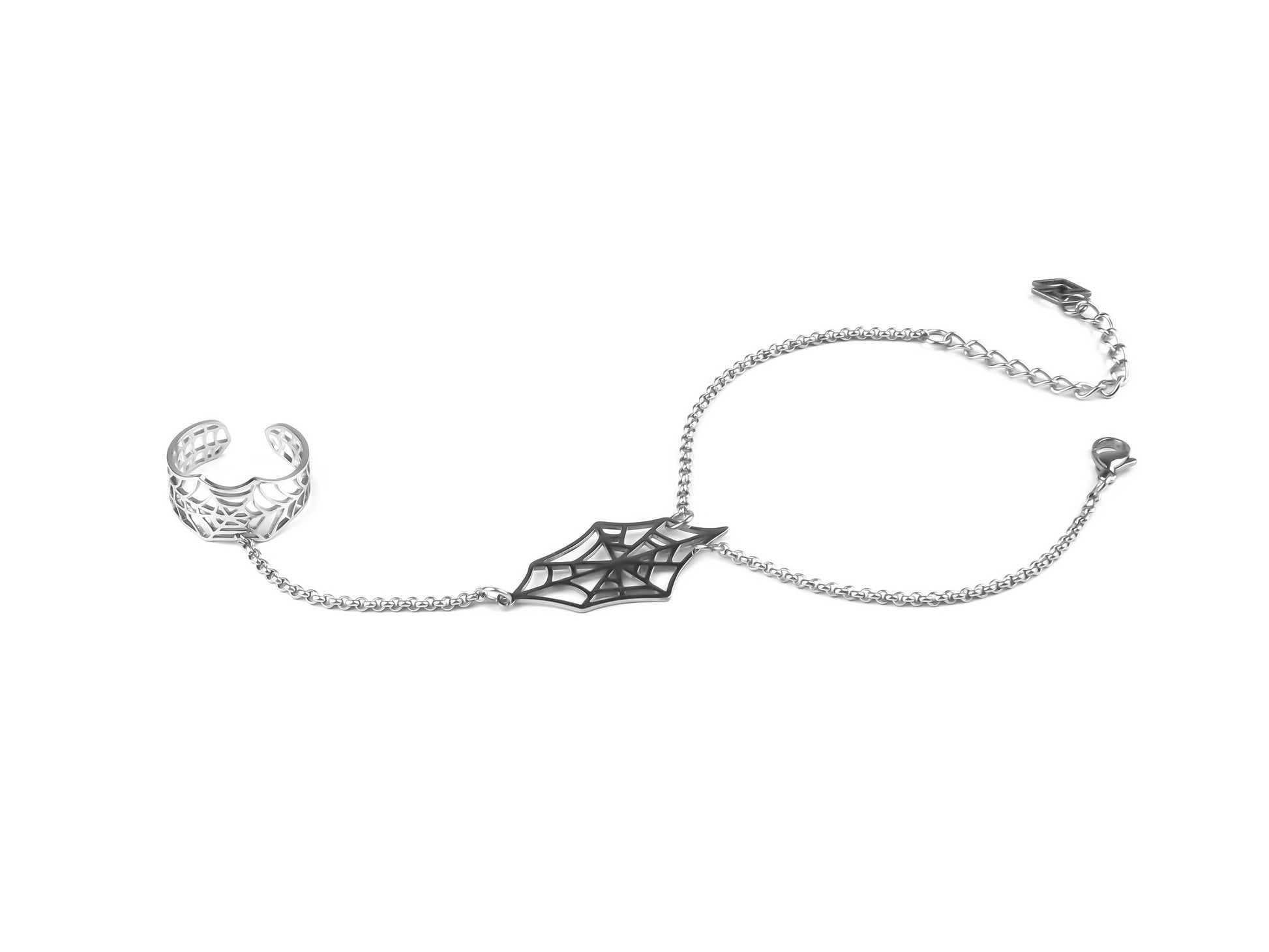  This Myril Jewels hand chain bracelet ring features a delicate spiderweb design, embodying the neo-goth aesthetic. The thin, silver-toned chain links a finely crafted ring to a matching wrist bracelet, highlighting a dark-avantgarde style. Perfect for gothic and alternative fashion lovers, it's a subtle nod to Halloween jewelry and an essential for whimsigoth or witchcore enthusiasts seeking minimal goth elegance for everyday wear or as statement rave party jewelry.