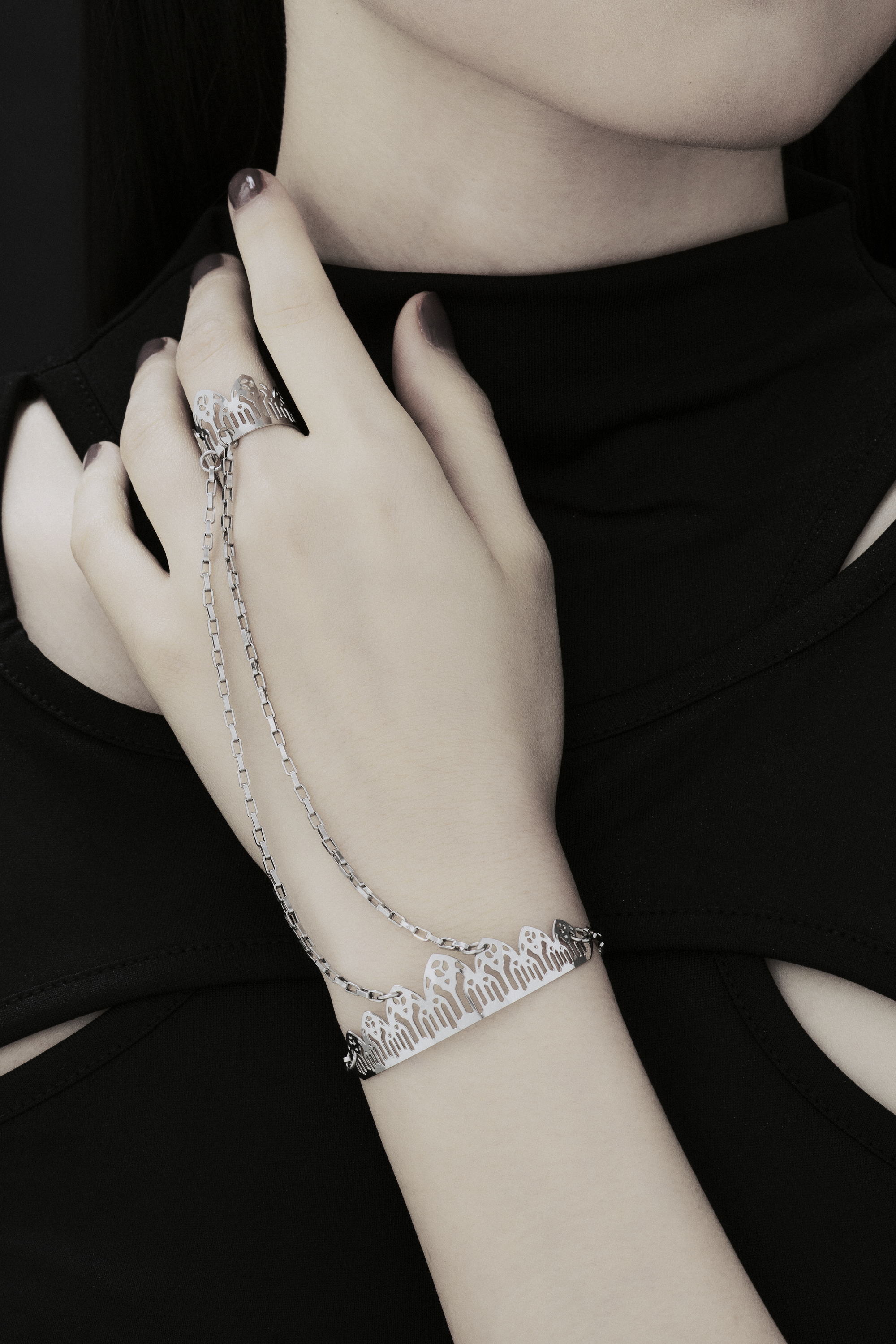 Adorn your wrist with the Myril Jewels punk hand chain bracelet ring, a masterpiece of dark-avantgarde jewelry. This gothic-chic accessory features an elaborate neo-gothic bracelet connected to a striking ring, crafted to perfection for the discerning alternative style enthusiast. The bracelet's unique design embodies the whimsigoth spirit, ideal for festival jewels enthusiasts or as a distinctive Halloween jewelry piece